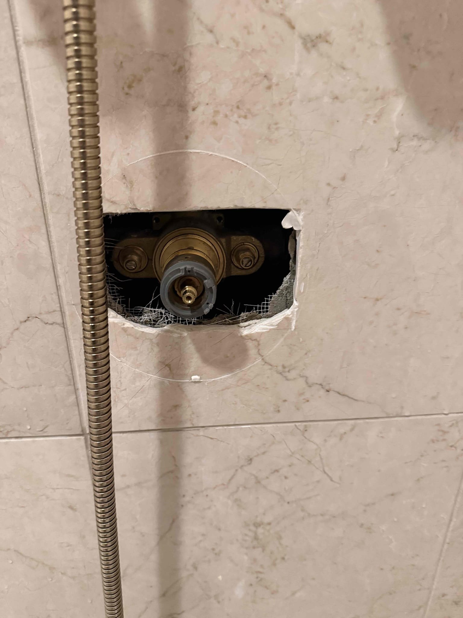 Arrived on site customer stated that they have a wet spot in the ceiling. Upon inspection found that the attic above the wet spot is dry and the only wet spot is on the surface of the ceiling in the bathroom. Also noticed that the connection between the shower head and the shower arm had to streams of water spraying up but is not reaching high enough to get the ceiling wet. Recommend fixing the leak on shower arm. It could potentially be customer is taking long hot shower and the moisture is building up and causing the water stains in the ceiling and the fan in the bathroom is not working properly. Messed around with shower head and got the stream to spray upwards towards the ceiling recreating the issues the customer was talking about. Replaced shower head gasket and tested all work and everything appears to be in working order and there appears to be no leaks at this time. Waived diagnostic fee.