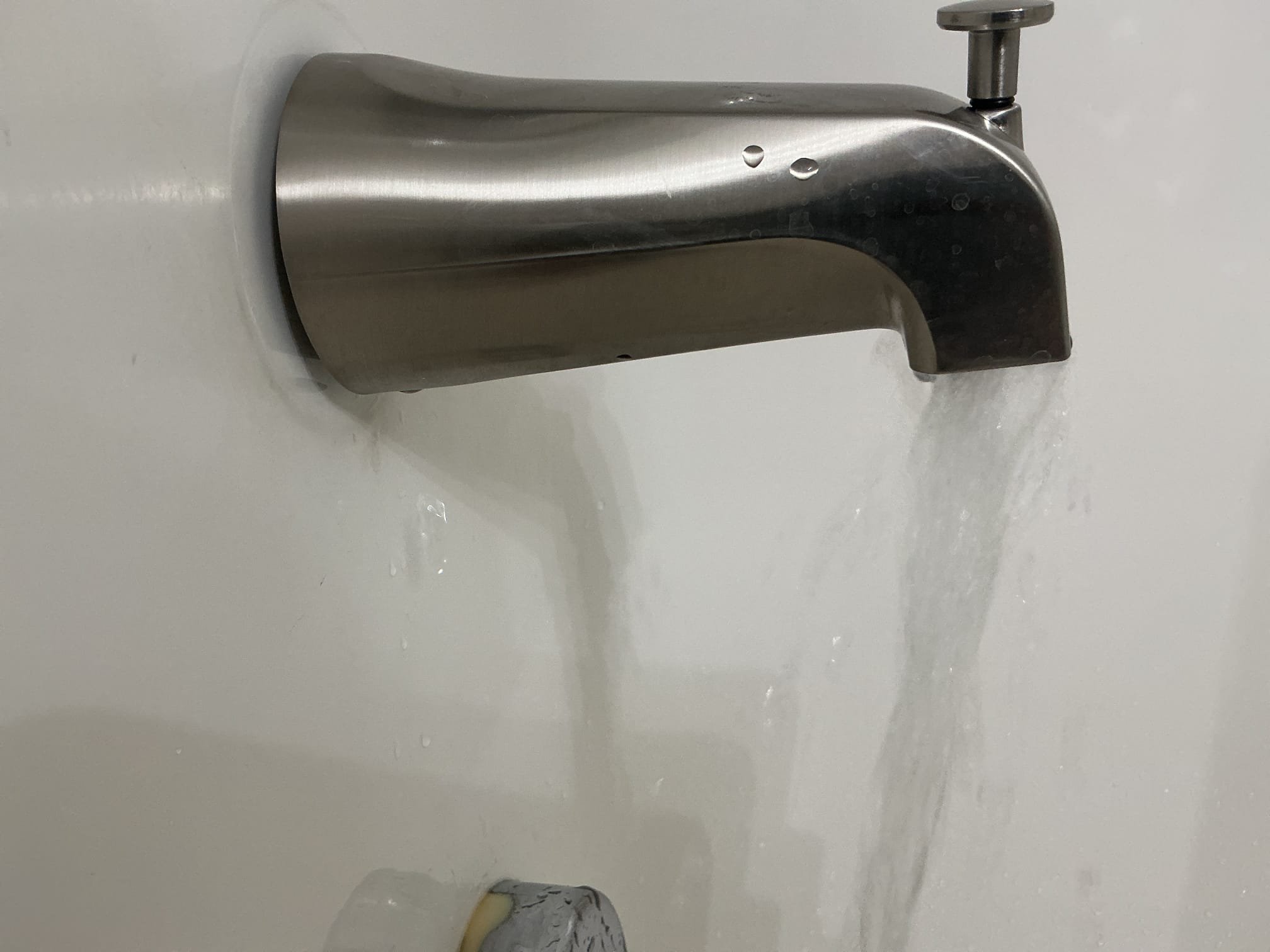 Arrived to the home, client had a really bad leak coming from their upstairs bathroom group. The ceiling had already been cut open so I can see all the piping. After testing for leaks I discovered that the tub spout is leaking in the wall whenever it is being used and leaks even worse when it diverts to the showerhead.

Disconnected existing tub spout for client.
Supplied and installed new Tub spout in its place.
Secured all my connections and turned the shower on and diverted it to check for leaks.
There are no leaks at this time.
Caulked shower trim as well for client.

*Water main is located in the downstairs hallways closet, but is not accessible at this time.