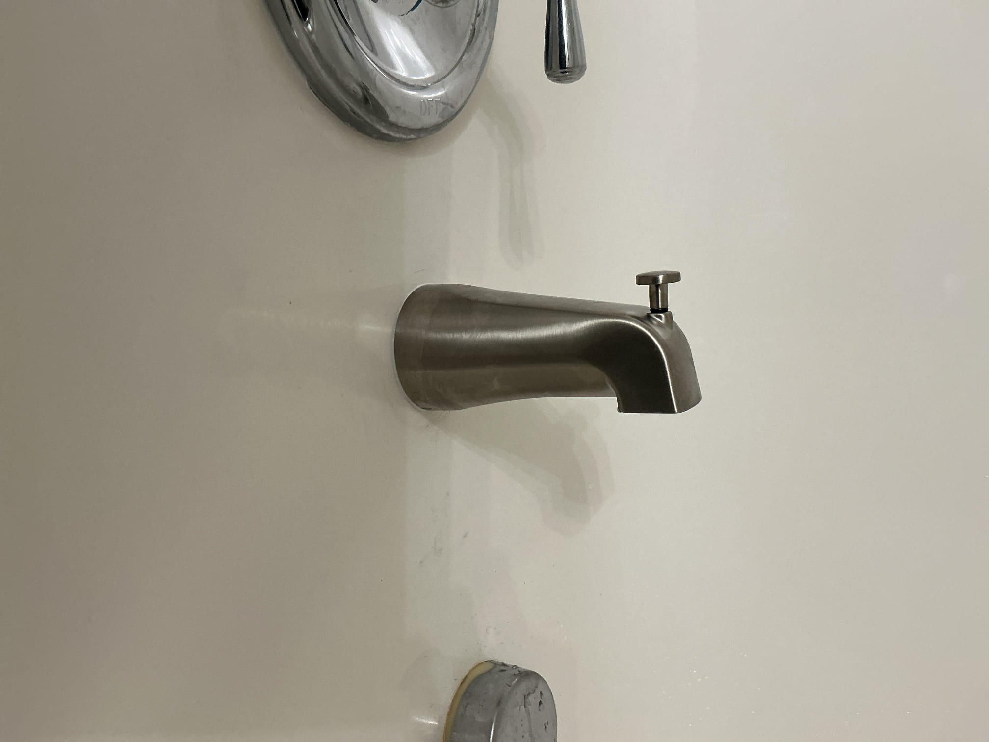 Arrived to the home, client had a really bad leak coming from their upstairs bathroom group. The ceiling had already been cut open so I can see all the piping. After testing for leaks I discovered that the tub spout is leaking in the wall whenever it is being used and leaks even worse when it diverts to the showerhead.

Disconnected existing tub spout for client.
Supplied and installed new Tub spout in its place.
Secured all my connections and turned the shower on and diverted it to check for leaks.
There are no leaks at this time.
Caulked shower trim as well for client.

*Water main is located in the downstairs hallways closet, but is not accessible at this time.