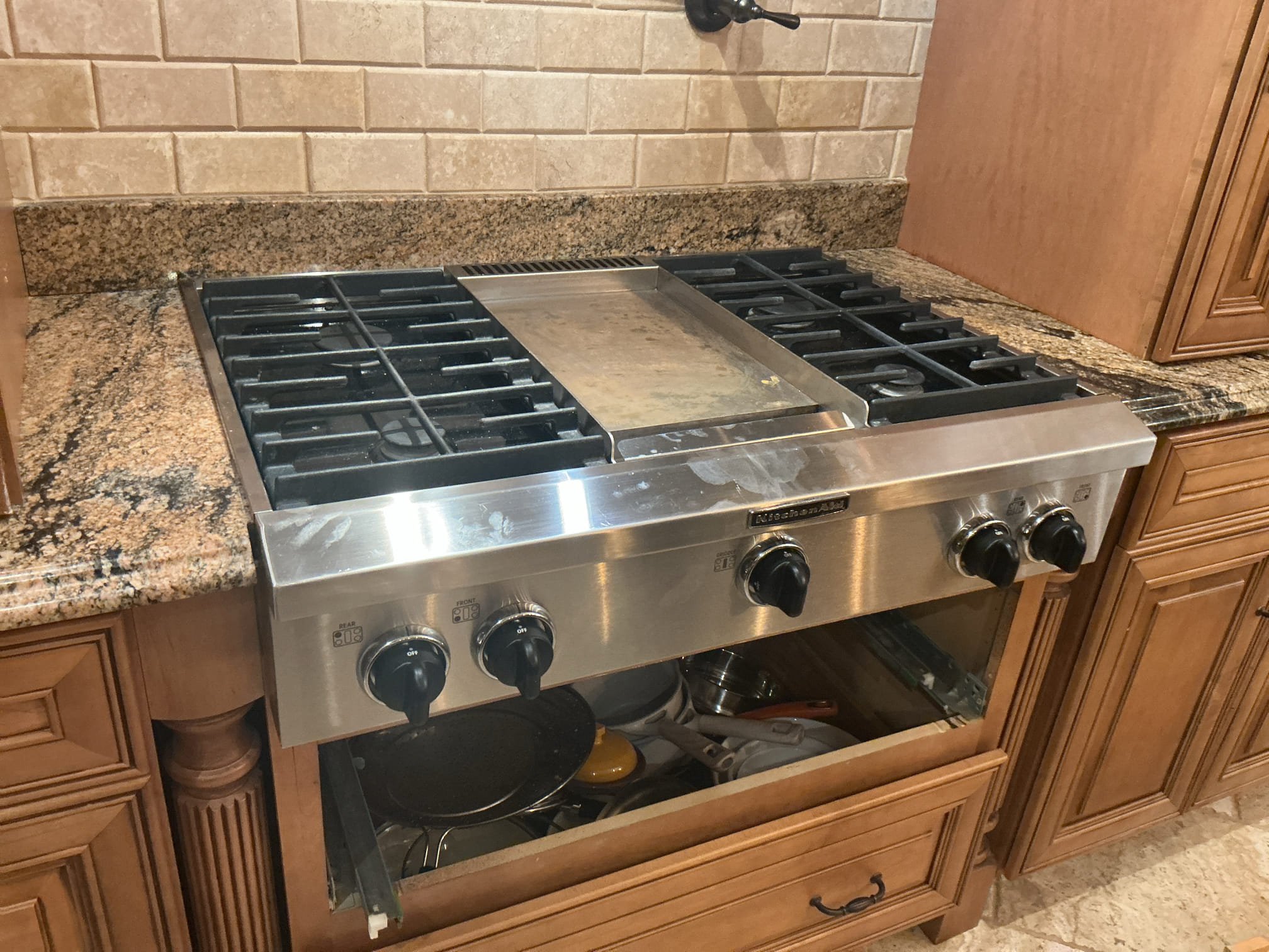 Arrived to the home, client has a new slide in cook top they would like us to install. After measuring dimensions and depth, the opening for the stove on the granite is 35in while the new cook top is 36in, also the cabinet would need to be cut down as well to fit the opening. Without cutting the granite and cabinet, it is not possible to install the cook top, client is aware of this issue.