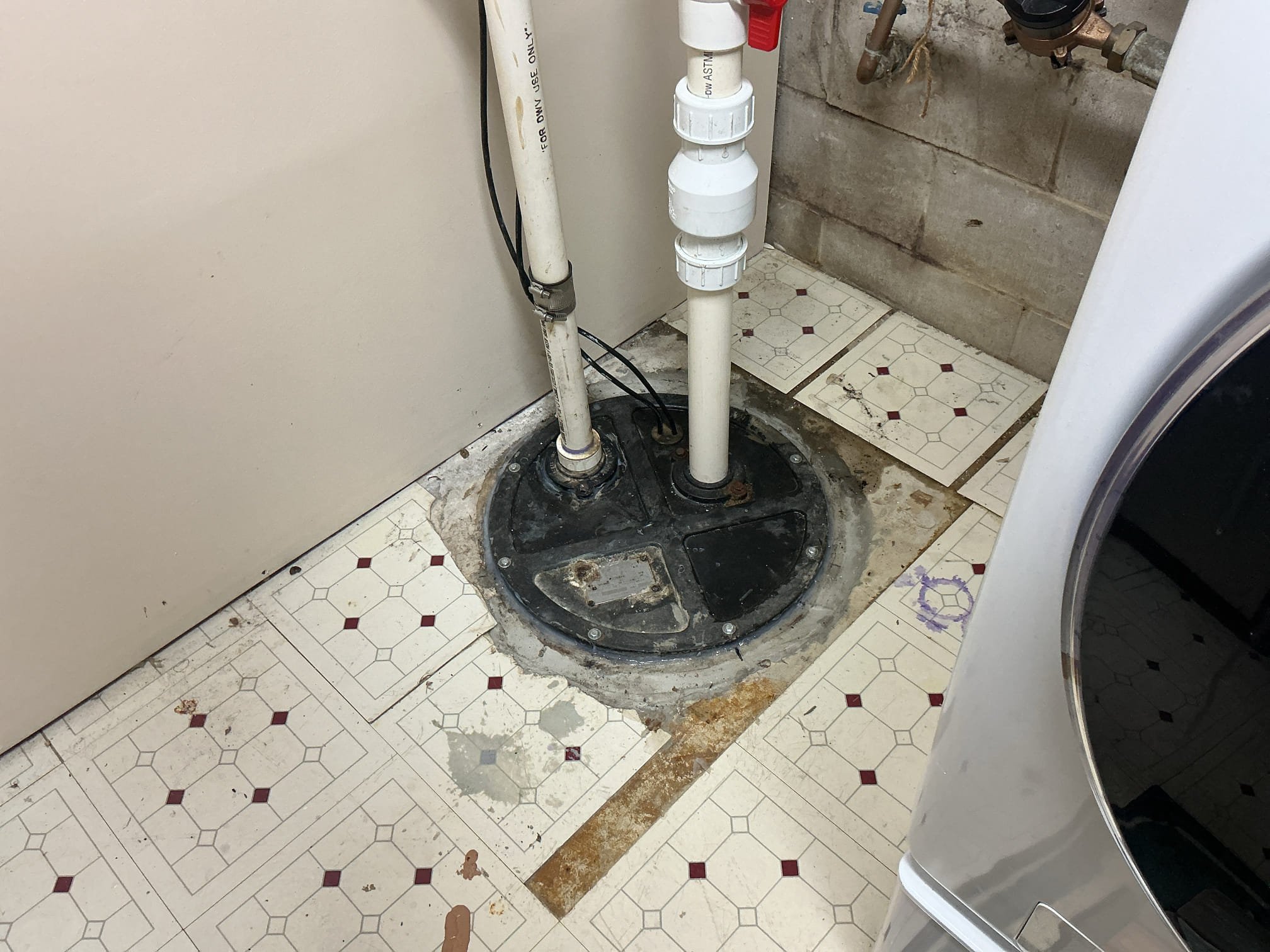 Arrived back to figure out issue with the sewer ejector. Client is stating that whenever they flush the toilet in the basement one time the pump goes off. I removed the lid and discovered scum and debris stuck on the float not allowing it to drop all the way down. I broke up the scum and removed what I could from the basin. I then added silicone in between the lid and basin, screwed the lid back in, and added more silicone around the whole basin. Ran fixtures and the pump is no working properly.