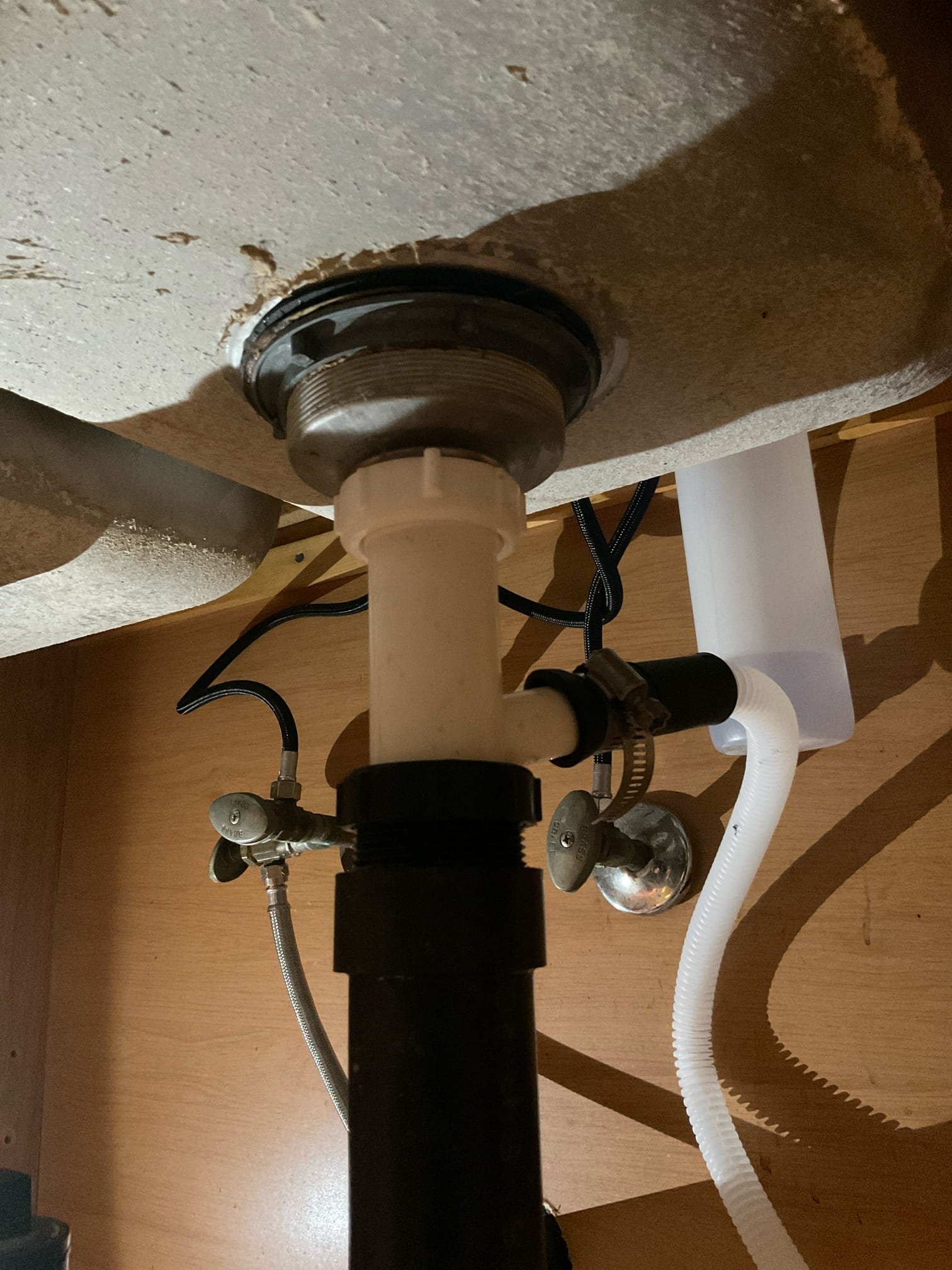 Arrived on site client stated that a pipe broke underneath while Home Depot was installing her new dishwasher. Upon inspection client had a 3/4 brass dishwasher tailpiece that snapped. Replaced dishwasher tailpiece and connected dishwasher hose to the pipe. Tested for leaks with hot water and when testing the trap union started slowly leaking due to having to take everything apart. Took trap apart and put pipe dope on it and tested for leaks again with hot water. There are no leaks at this time at the dishwasher connection or the trap union.