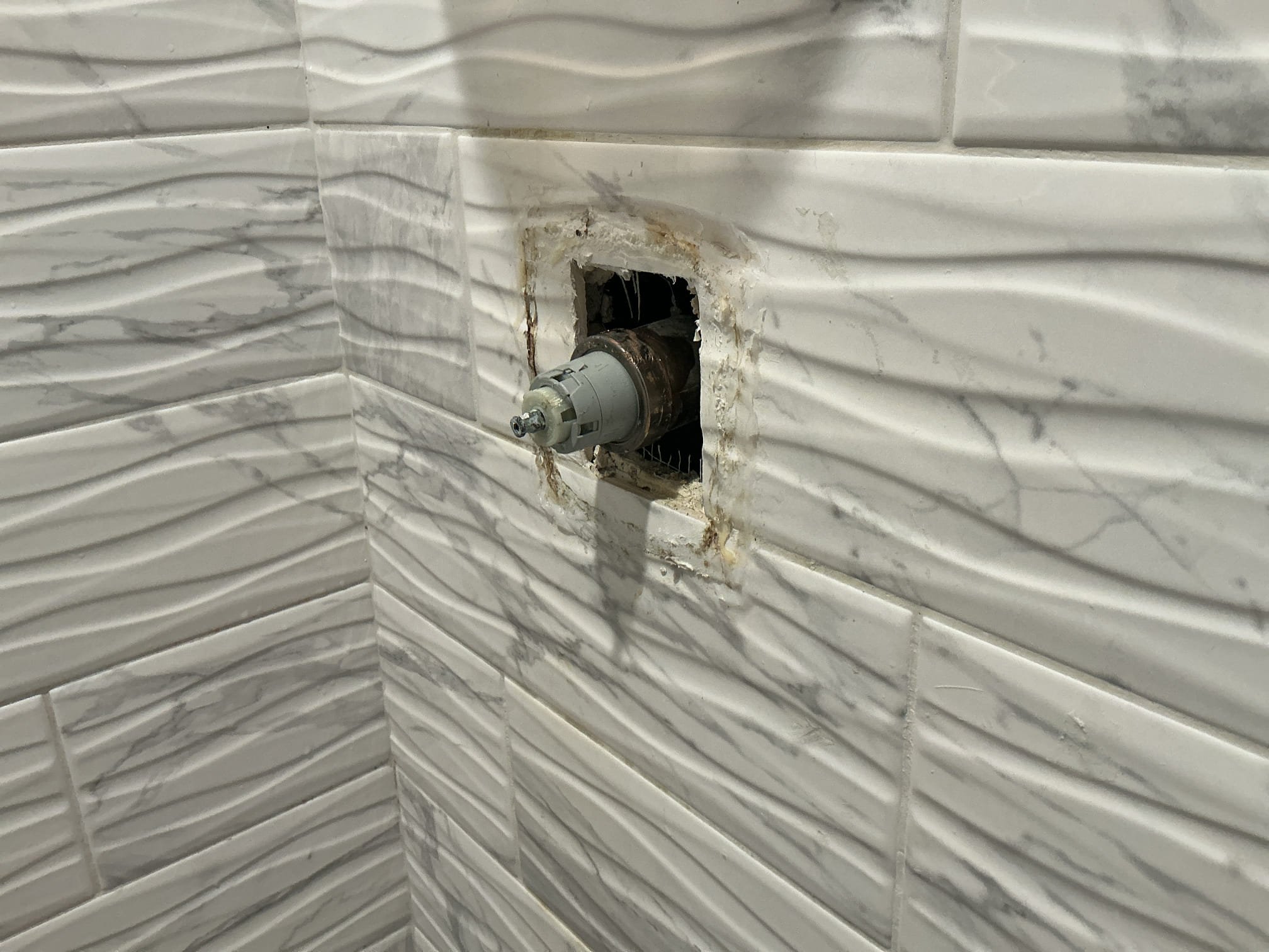 Arrived to the home, client has an existing delta shower valve that the shower head with not stop dripping. At first glance, I can tell that the existing trim is not correct and is missing piece for it. A handyman had used silicone to secure the flange plate to the shower walls. After I extracted the cartridge out, the client approached me and advised me that they would like to go through with the shower valve replacement given the certain circumstances of the existing shower valve. Client has requested to have me come back next Tuesday Morning First Stop to replace the shower valve through tile. I am accepting a deposit to secure client spot on the schedule.