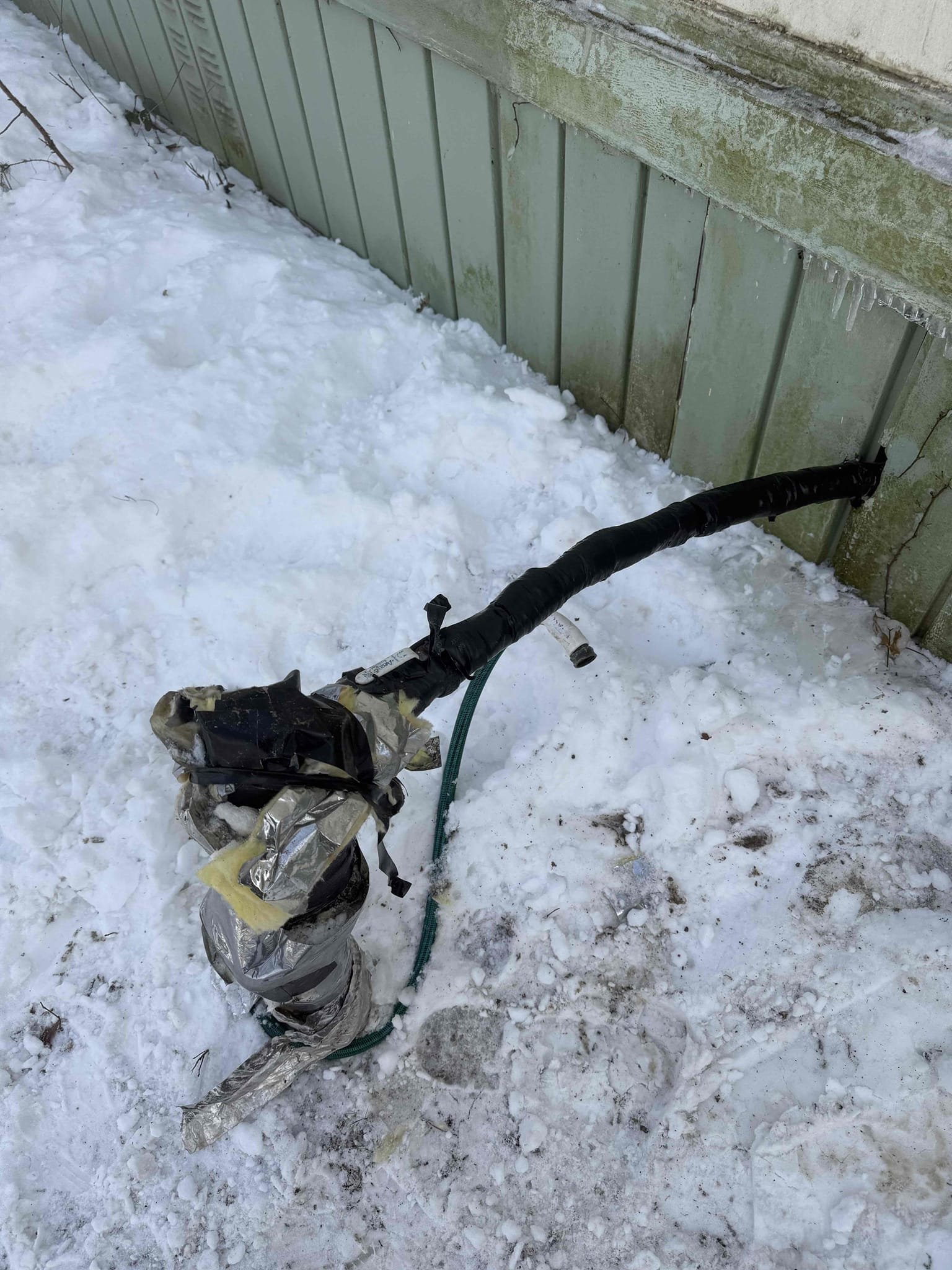 Arrived on site customer stated that they have a leak and frozen pipes. Upon inspection found that the water services comes up out of the ground outside of the home and the heat tape is no longer working. Recommend customer gets heat tape or some sort of enclosure so this issue does not happen again. Gave options to thaw out pipes. Thawed pit piping and then located leak underneath bathtub two polybutylene lines that have pinholes in them. Repaired with sharkbite couplings but cannot warranty work due to piping being polybutylene. Tested all work and everything appear to be in working order and there appears to be no leaks at this time. Customer wanted to replace faucet but found that the sink was made of plastic and cracked all over and I am concerned that we will damage the sink even more and will not be able to install the faucet. Recommend replacing entire sink and faucet and we will install shut off valves as a courtesy.