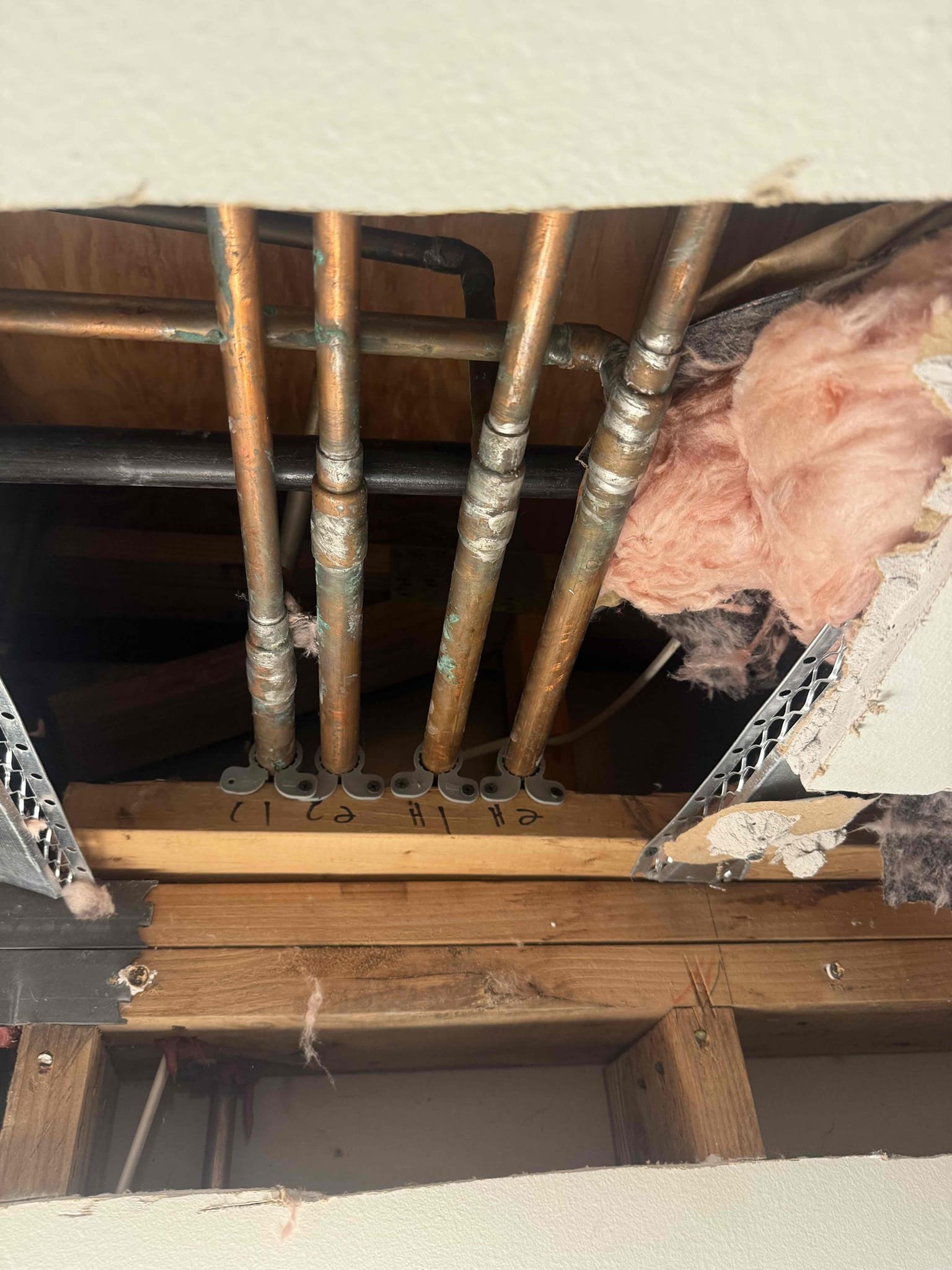 Correcting crossed water lines in a limited access area
Arrived to unit for uncommon issue. Upstairs was vacant and water was off but still had hot water to bathroom sink. Unit downstairs was on. Maintenance opened up multiple spot of Sheetrock so we can further diagnose. Unit downstairs also did not have hot water to lav faucet when water heater upstairs was off. This told me there was a cross in the line somewhere. Came to find out that 2 tees off if the main branch were swapped . MyGuy diagnosed and corrected issue by cutting out tees and re connecting to correct lines. Turned water back on to both units and did multiple tests. Unit water lines are now separated and each unit has its own hot water lines. There are no leaks at this time. MyGuy is not responsible for Sheetrock that was removed.