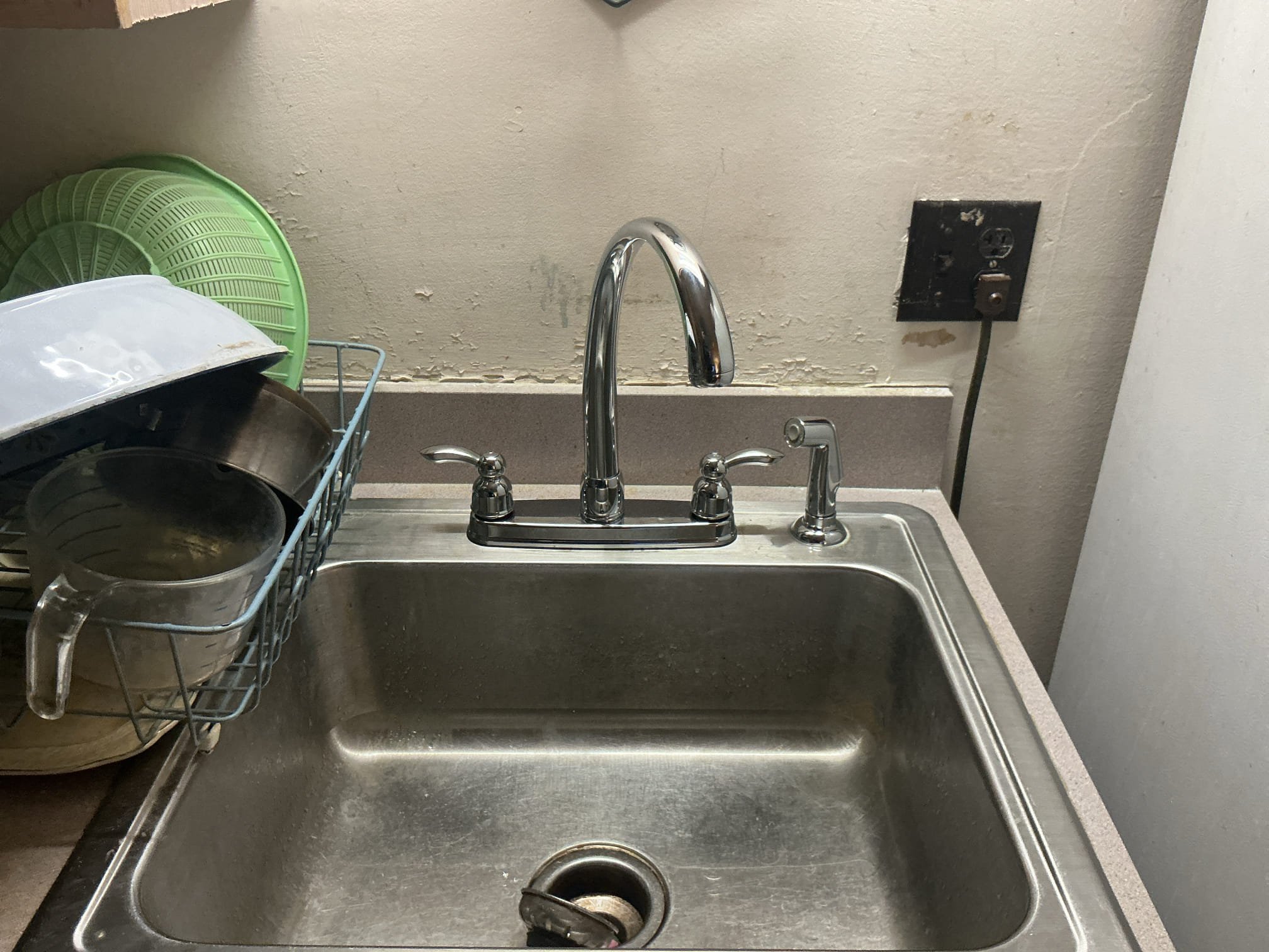 Arrived to the home, water was currently off to the home due to an active leak. When I got to the home, client stated that the son had came four and discovered that the leak was coming from a broken copper pipe that feeds a hose bib. Their son had turned off the ball valve for the hose Bibb and the leak has stopped. Client would like to not go through with the pipe repair at this time. While speaking to the client, I discovered that the existing kitchen faucet was leaking into the sink and underneath it. I provided options and client would like to replace their faucet at this time.

Disconnected and removed existing faucet from the home.
Supplied and installed new high Arc kitchen faucet for the client.
Secured my connections and turned the valves on to check for leaks.
There are no leaks at this time.

*While I was here, the clients son had stated that the town had shut off the water at the curb due to the leak, that why the water was turned off to the home.
*Water main is located in 