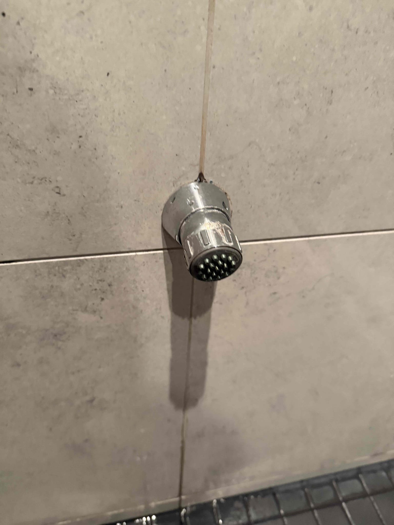 This option includes replacing volume control, shower cartridge. Currently customer is experiencing a slow drip from bottom shower sprayer, this is due from the control cartridge, failing letting water slip by. This includes replacing control cartridge. 
Arrived back to home to install new volume control cartridge. Turned water off to home and removed old one. Replaced with new. Turned water on to test for leaks, there are none at this time. Being the way sprayers are piped in the wall, after turning off water will continue to drip from bottom sprayer until pipes connected are empty of water. This is because there is residual water left in pipes after cartridge is turned off. 