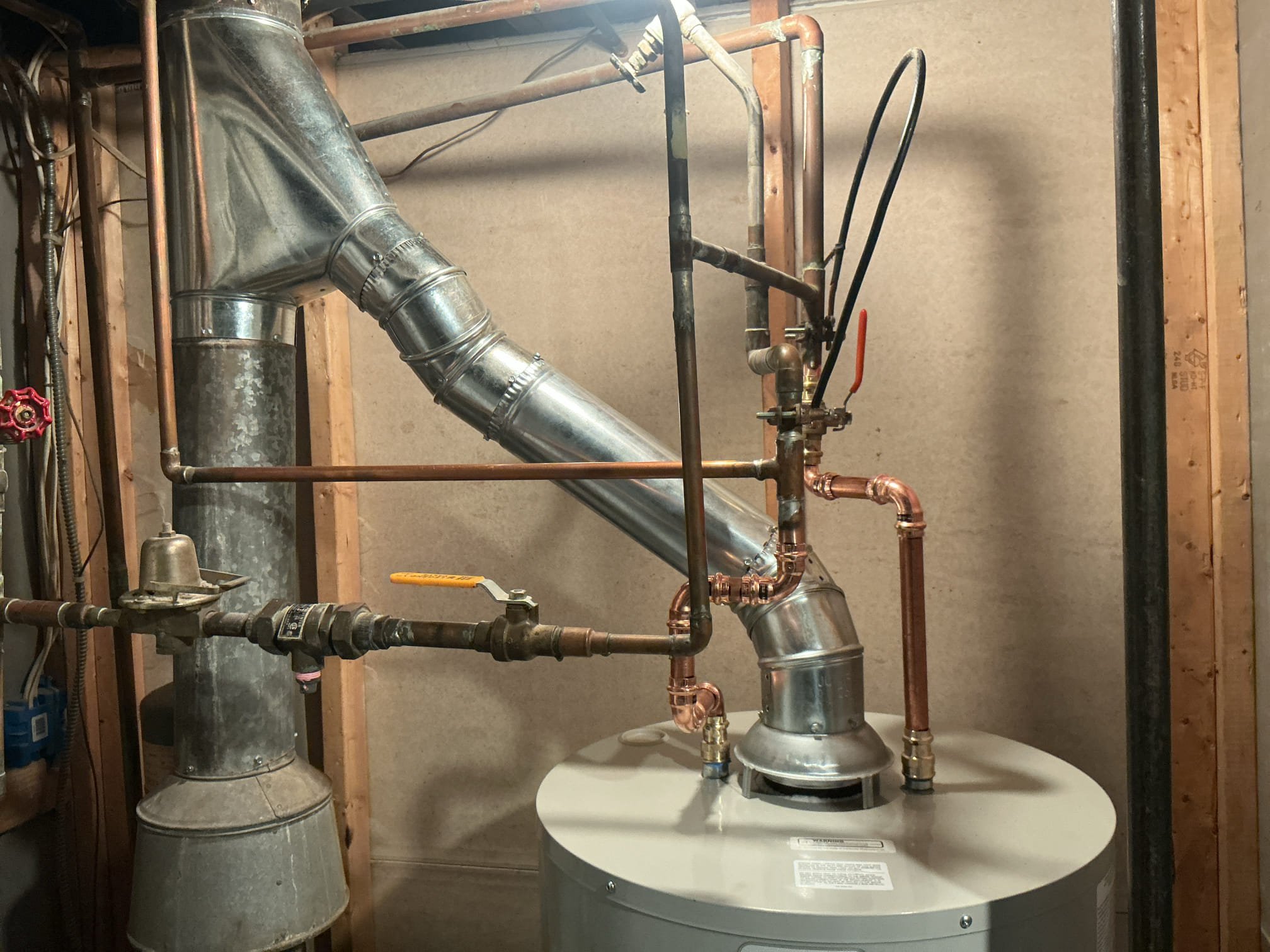 Drained and removed existing water heater from the home.
Supplied and installed new 40 gallon short natural draft water heater.
Supplied and installed new ball valve, gas valve, gas flex, copper pipe and fittings.
Secured all connections and pressurized the system.
Upgrade the flu from 3in to 4in by code.
Turned system on to check for leaks.
There are no leaks at this time.

*Permit fees are at homeowners cost.
*Client is now a member.
*I made client aware that prior to the inspection, there is a good chance they may need to have a chimney liner installed on the existing interior chimney prior to inspection, client is aware. I have passed off McNally Chimney contact information to the client.
*Client has requested to have the permit mailed to their home.