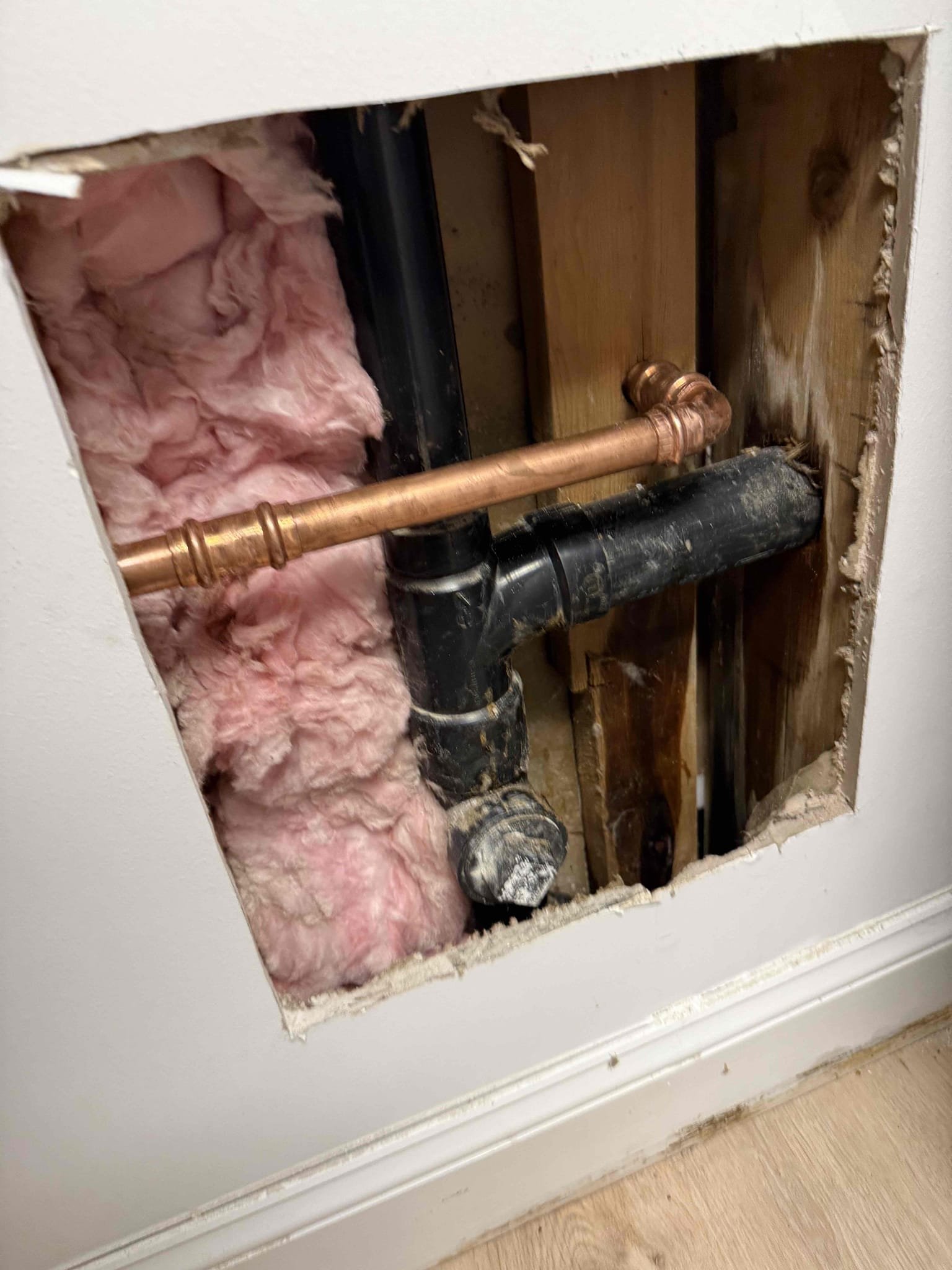 Arrived on site customer stated that they had a leak behind the wall of the washer and dryer. After inspecting, MyGuy Plumbing cut the Sheetrock to access the leak. After cutting open a section of sheet rock we noticed that the 3/4 copper line has a pinhole leak. MyGuy plumbing gave customer options to repair leak. After all work was completed MyGuy plumbing turned the water on to the home and tested for leaks. At this time there are no leaks found. Everything is working as should.