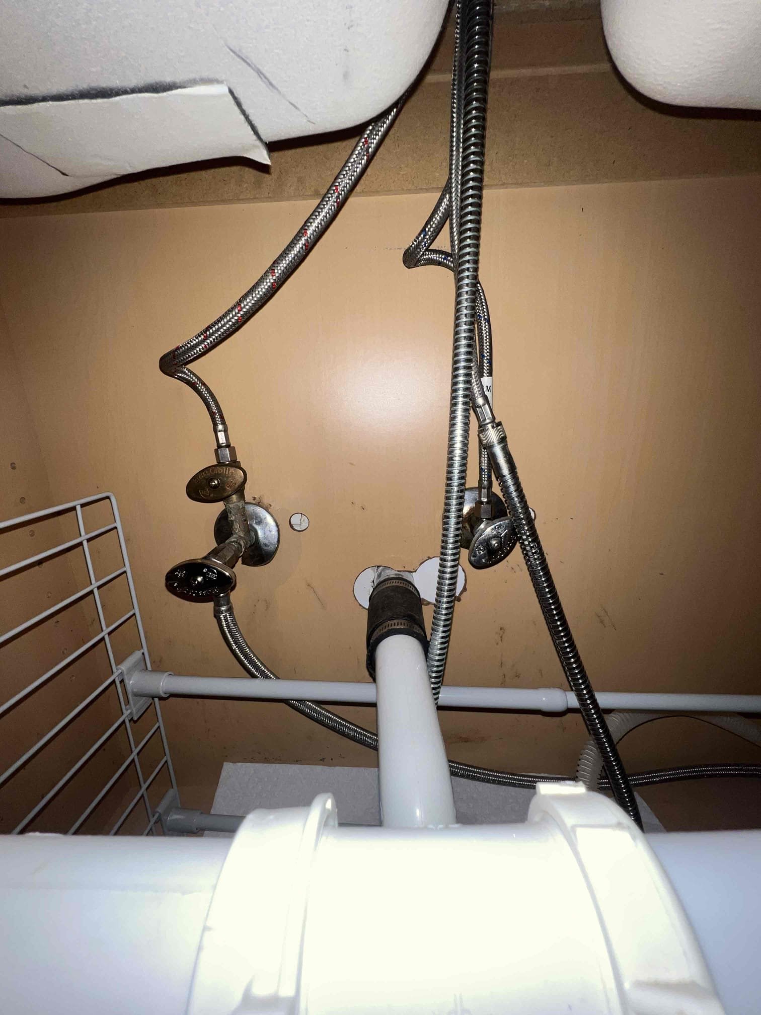 Arrived on site to perform plumbing inspection. Upon arrival client stated she had a leak at her kitchen faucet and it would drip underneath the sink. After running water I found that the faucet head was not tightened on the way on the head of the faucet and that’s where it would leak from. Tightened the faucet and it would no longer leak. All three shutoff valves do not turn by hand under the kitchen faucet along with the cold side valve underneath the hallway lav sink. Client has 2 gate valves I recommend get replaced with ball valves.