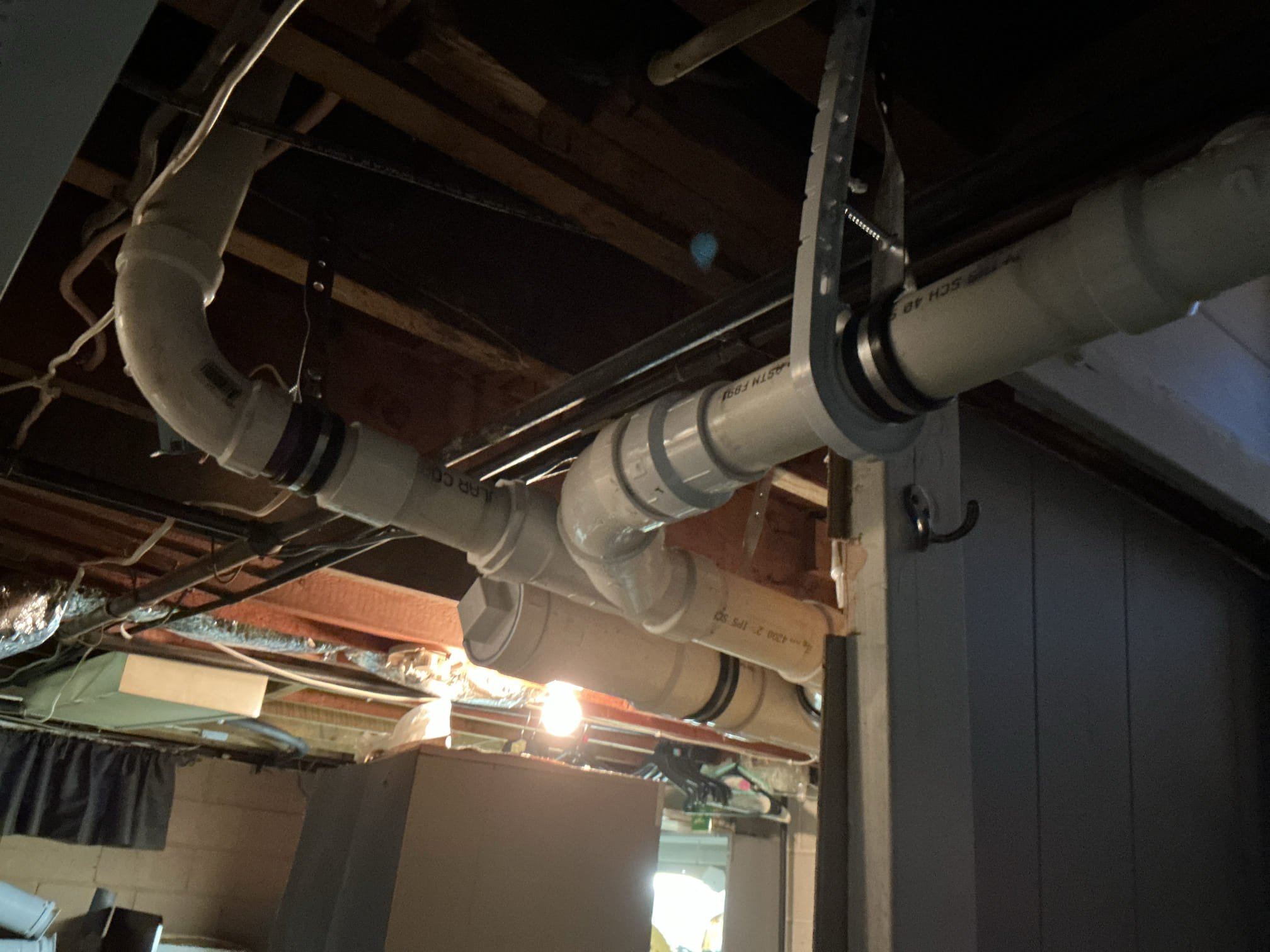  Upon arrival met with Stacy who brought us down to the basement. Bunch of illegal fernco couplings all over that have failed causing the drain piping to fall and sag everywhere. We will be removing all of the copper ,cast iron and galvanized drain piping and replacing with new pvc. 

Kitchen sink - installing new stainless steel drop in sink with new Moen Arbor pull down kitchen faucet. Replacing 3 emergency stops under the sink as well. 2 - hot for faucet and dishwasher. 1- cold for faucet.
New basket strainer and drainage including a new Studor vent to properly vent this kitchen line, and reconnecting to existing dishwasher discharge and copper water supply line. Routing the dishwasher discharge in the best possible better manner. Matching soap dispenser installed to match the faucet. New 1-1/2 pvc drain line will also be installed from the kitchen sink across the basement to where it will connect to the building drain. Proper hangers and cleanouts will be added where needed. Stacy 