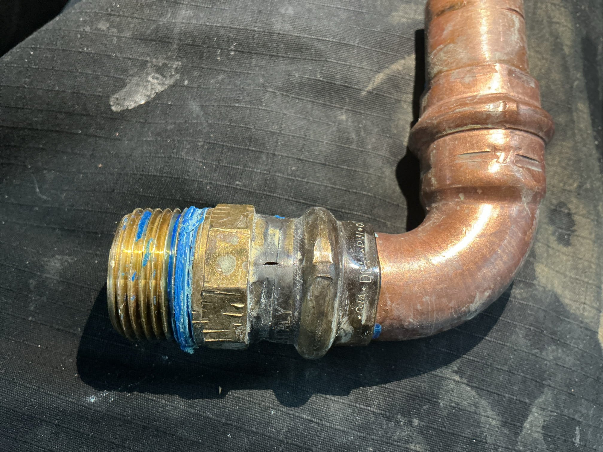 We had recently installed a customer supplied carbon filter, filtration system in the crawlspace for the client. I arrived today due to the client stating that the crawlspace is flooded and the water is turned off to the home, and the leak is coming from a press connection that we installed. In the entrance of the crawlspace there is about 4in of water by on the other end where the flitration system is, there is about 8in of standing water. Client has a roller on site for me to use to get over to the system to see where the leak is coming from. The leak appears to be on a pro press male adapter that we had installed for the system. Client has set me up with an auxiliary pump they have to begin draining the water out of the crawlspace for me so I can properly make the repair. I cut the piping before the filter, and removed the damaged male adapter. I then supplied and installed new copper pipe and fittings and secured all the connections. Pressed my connections then had the client turn 