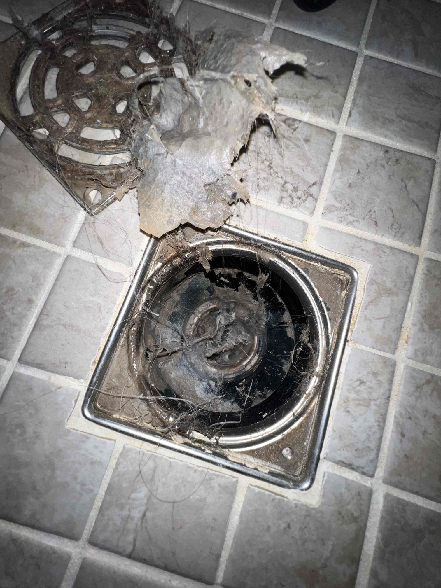 Arrived on site client stated their shower was slow draining. Client also mentioned to me after a few flushes they would see a little bit of water from underneath the toilet. Gave options to pull and reset toilet and to snake shower. Client would just like to snake the shower for today. After snaking the shower I pulled out massive amounts of hair and the shower was draining like new again. Put a camera down and there does not appear to be anymore hair or debris blocking the flow of water. 