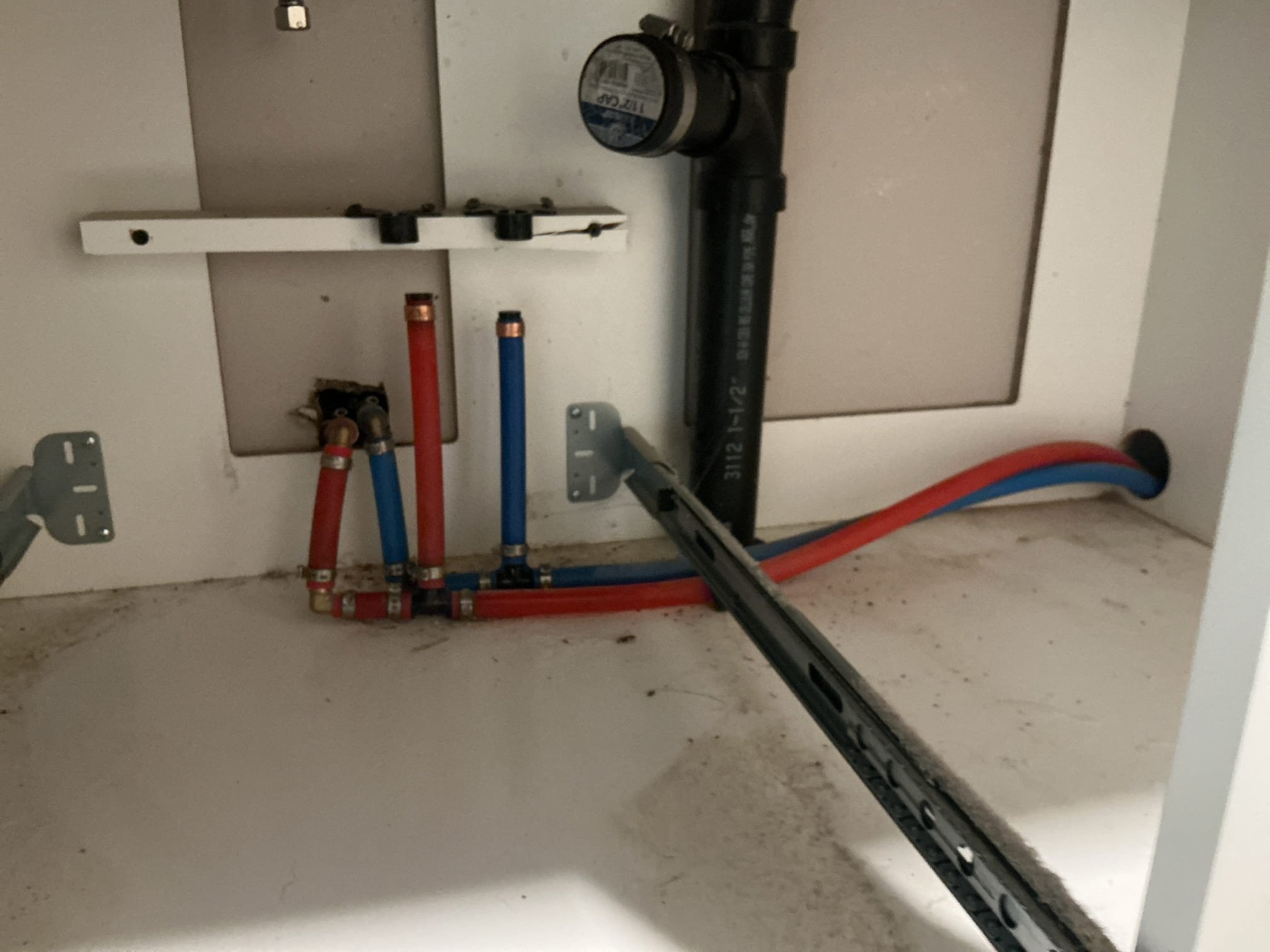 Pulled and disconnected toilet from the home.
Plugged off drain and capped off water line for toilet.
Disconnected shower trim and drain.
Left dollar plug for drain after removal of bathtub.
Cut and capped off water and waste for under the vanity.

*The water lines for the vanity, appear to tee off and go under trailer and rise up to provide water for the shower in the other bathroom. Vanity will needed to be demolished at the time of removal, homeowner is aware.