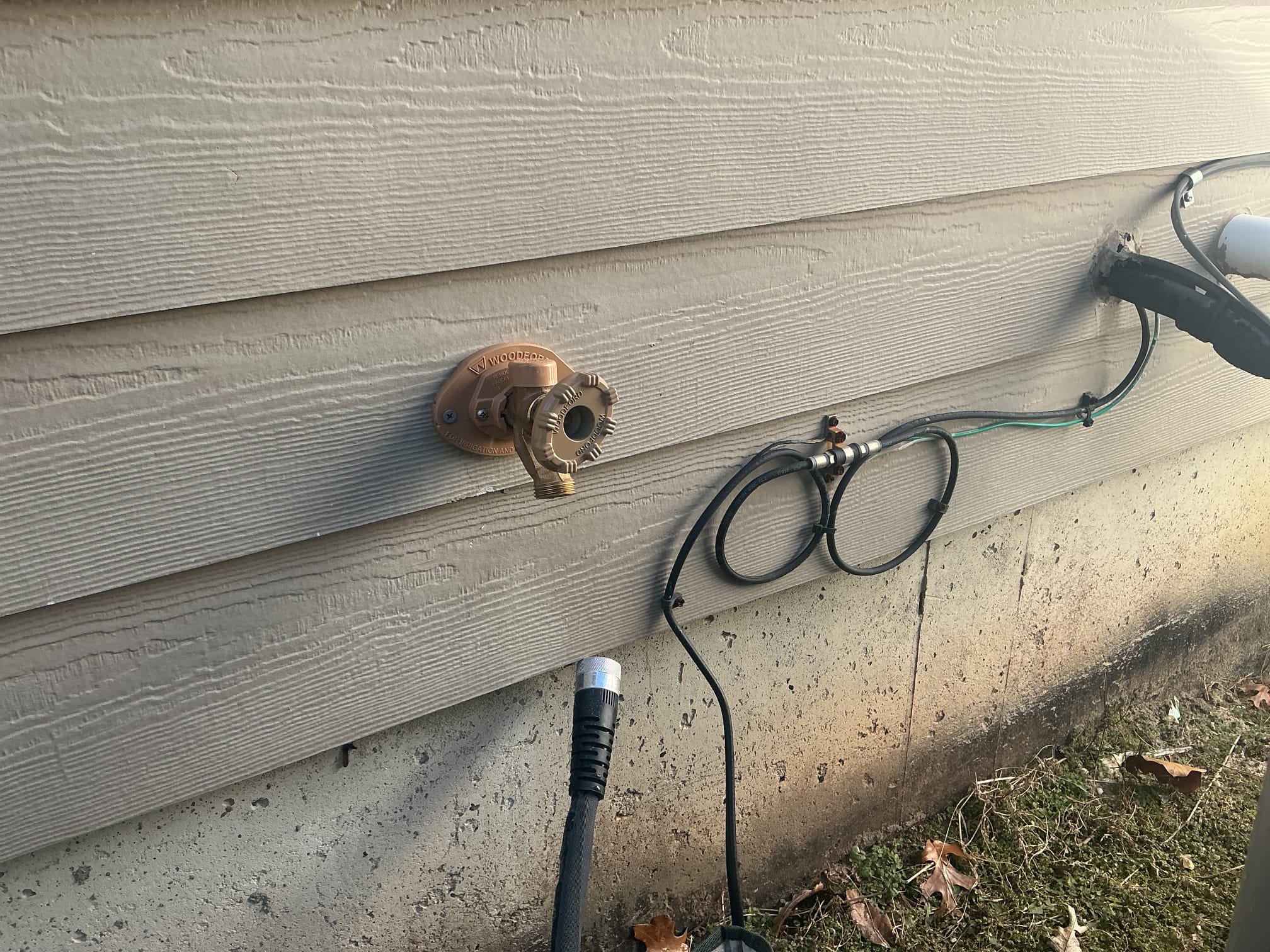 Cut open Sheetrock to expose damaged drain stack.
Cut out and removed damaged piping.
Supplied and installed 3in no hub coupling and made up the difference.
Secured my connection and ran all fixtures in the bathroom group to check for leaks.
There are no leaks at this time.

Disconnected and removed existing hose bib.
Supplied and installed new hose Bibb with oversized plate to cover the larger hole.
Secured hose Bibb to the home.
Made up water connections in basement.
Secured those connections and turned the ball valve on to the hose Bibb to check for leaks.
There are no leaks at this time.