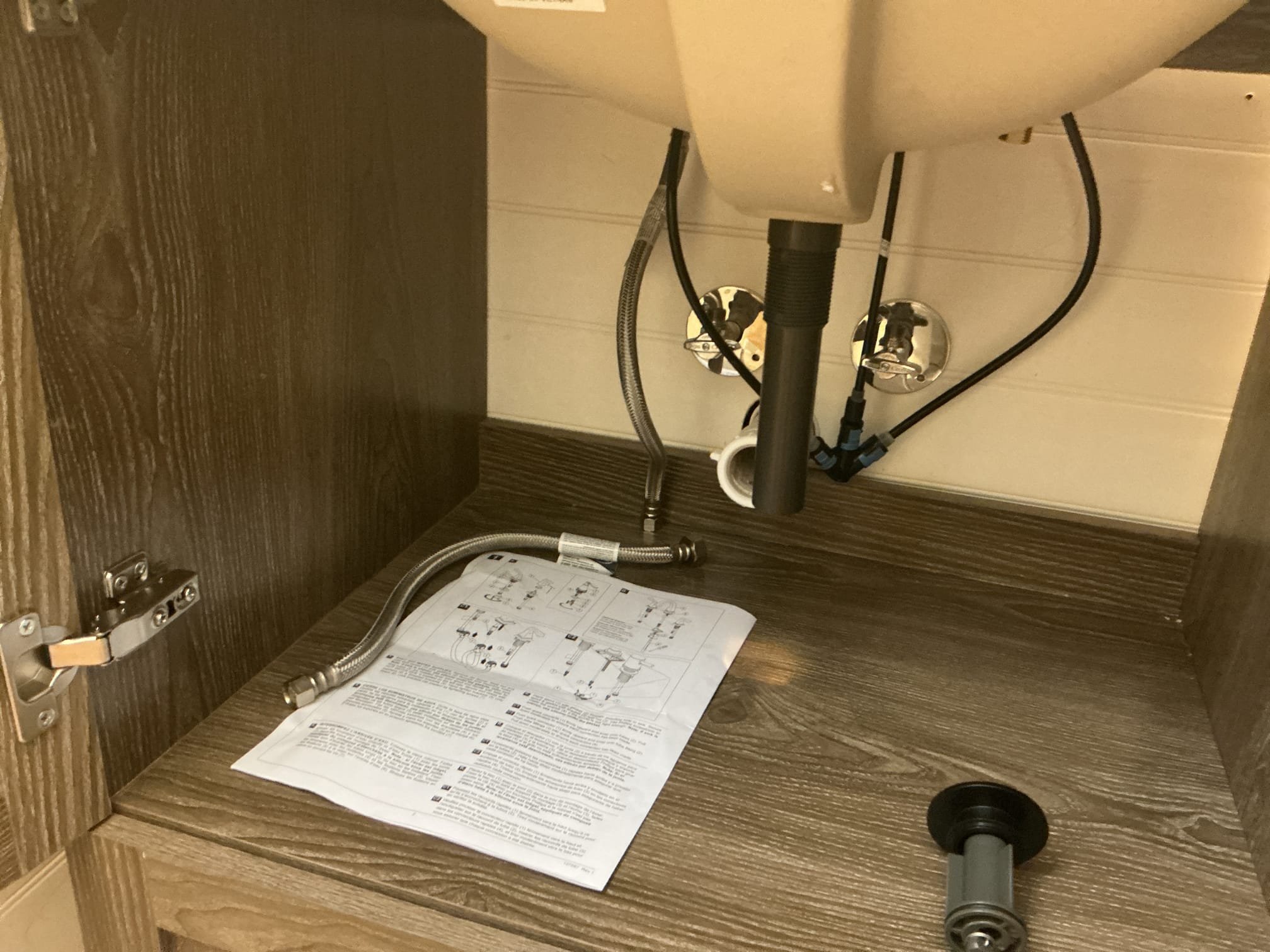 Arrived to the home, client attempted to replace their vanity but the newer vanity has a drawer under neither and the drain is very shallow and the existing tubular trap will not work, client had already installed the faucet we we arrived. I first was going to raise the trap arm up and install a vent but the teewye would be to high. I next decided to install a shallower p trap to make up the difference.

Drilled vanity to the studs.
Supplied and installed new 1 1/4 shallow trap and supply lines.
Secured all my connections and pressure tested the vanity to check for leaks.
There are no leaks at this time.
Caulked vanity for client as well.

*Full warranty on everything supplied by MyGuy Plumbing, labor warranty only on customer supplied vanity and faucet.