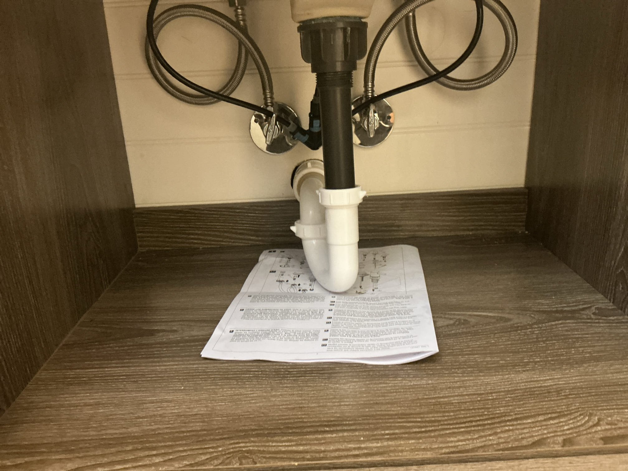 Arrived to the home, client attempted to replace their vanity but the newer vanity has a drawer under neither and the drain is very shallow and the existing tubular trap will not work, client had already installed the faucet we we arrived. I first was going to raise the trap arm up and install a vent but the teewye would be to high. I next decided to install a shallower p trap to make up the difference.

Drilled vanity to the studs.
Supplied and installed new 1 1/4 shallow trap and supply lines.
Secured all my connections and pressure tested the vanity to check for leaks.
There are no leaks at this time.
Caulked vanity for client as well.

*Full warranty on everything supplied by MyGuy Plumbing, labor warranty only on customer supplied vanity and faucet.