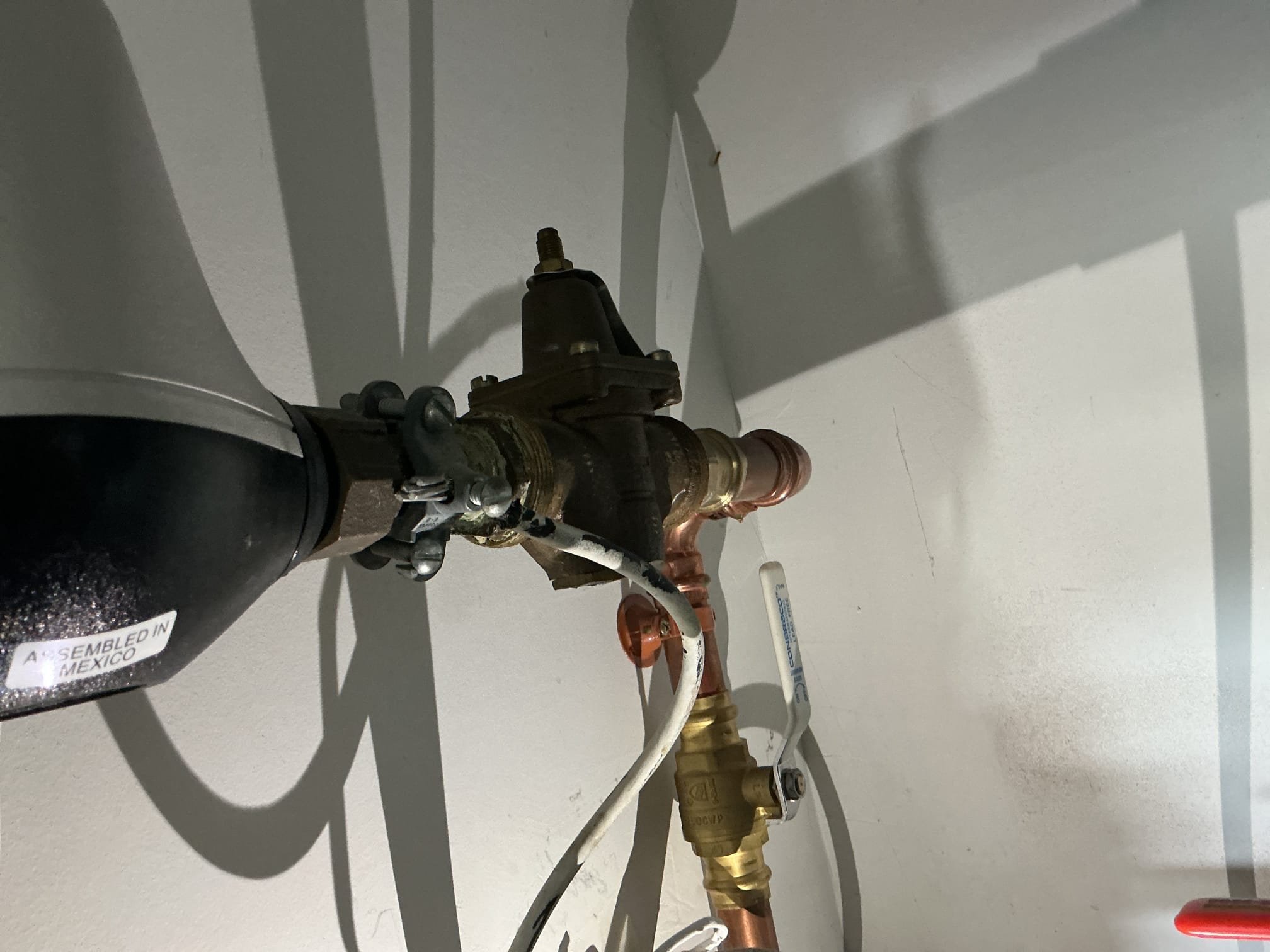 Arrived to the home, we had recently come out due to the client experiencing weird humming noises throughout the home whenever a toilet is flushed or a faucet is ran. I diagnosed this issue as a failing PRV that is located above the water heater. Client stated the also experienced different pressures throughout the day.

Turned off water t9 the home and drained the system.
Disconnected and removed existing PRV from the home.
Supplied and installed brand new 1in PRV before the meter.
Secured all my connections and turned the water on to the home to check for leaks.
There are no leaks at this time.
Prior to install, i checked water pressure and it was at 61psi
I adjusted the new PRV pressure to what the home normally is at.