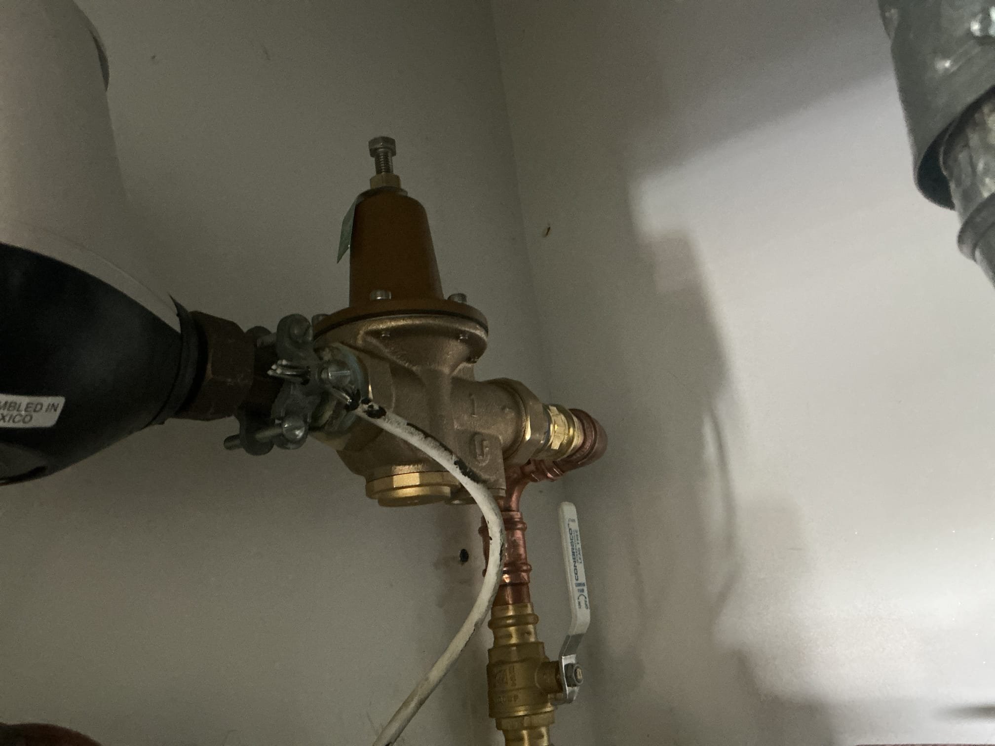 Arrived to the home, we had recently come out due to the client experiencing weird humming noises throughout the home whenever a toilet is flushed or a faucet is ran. I diagnosed this issue as a failing PRV that is located above the water heater. Client stated the also experienced different pressures throughout the day.

Turned off water t9 the home and drained the system.
Disconnected and removed existing PRV from the home.
Supplied and installed brand new 1in PRV before the meter.
Secured all my connections and turned the water on to the home to check for leaks.
There are no leaks at this time.
Prior to install, i checked water pressure and it was at 61psi
I adjusted the new PRV pressure to what the home normally is at.