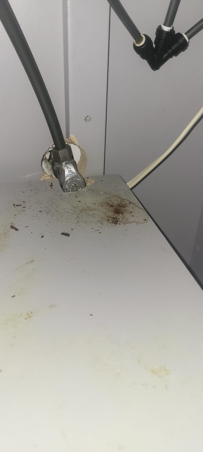 Arrived to the home, client states there is a leak from the upstairs down to the first floor ceiling. There is a little bubble in the ceiling with a small bathroom group above. I advised to the client to have us cut open the ceiling to further diagnose the issue. Once the ceiling was open, I can not see any plumbing but I do know there is a vanity close to the spot. I ran water and flushed the toilet. After running water in the vanity i noticed a drip from the wide spread lav faucet. That drip has been going on for a while and it appears that that is the source of the water stain. There is also an illegal electrical box under the vanity that is not up to code. I advised to the client to have us replace the vanity. Will give a quote for the work to be completed.