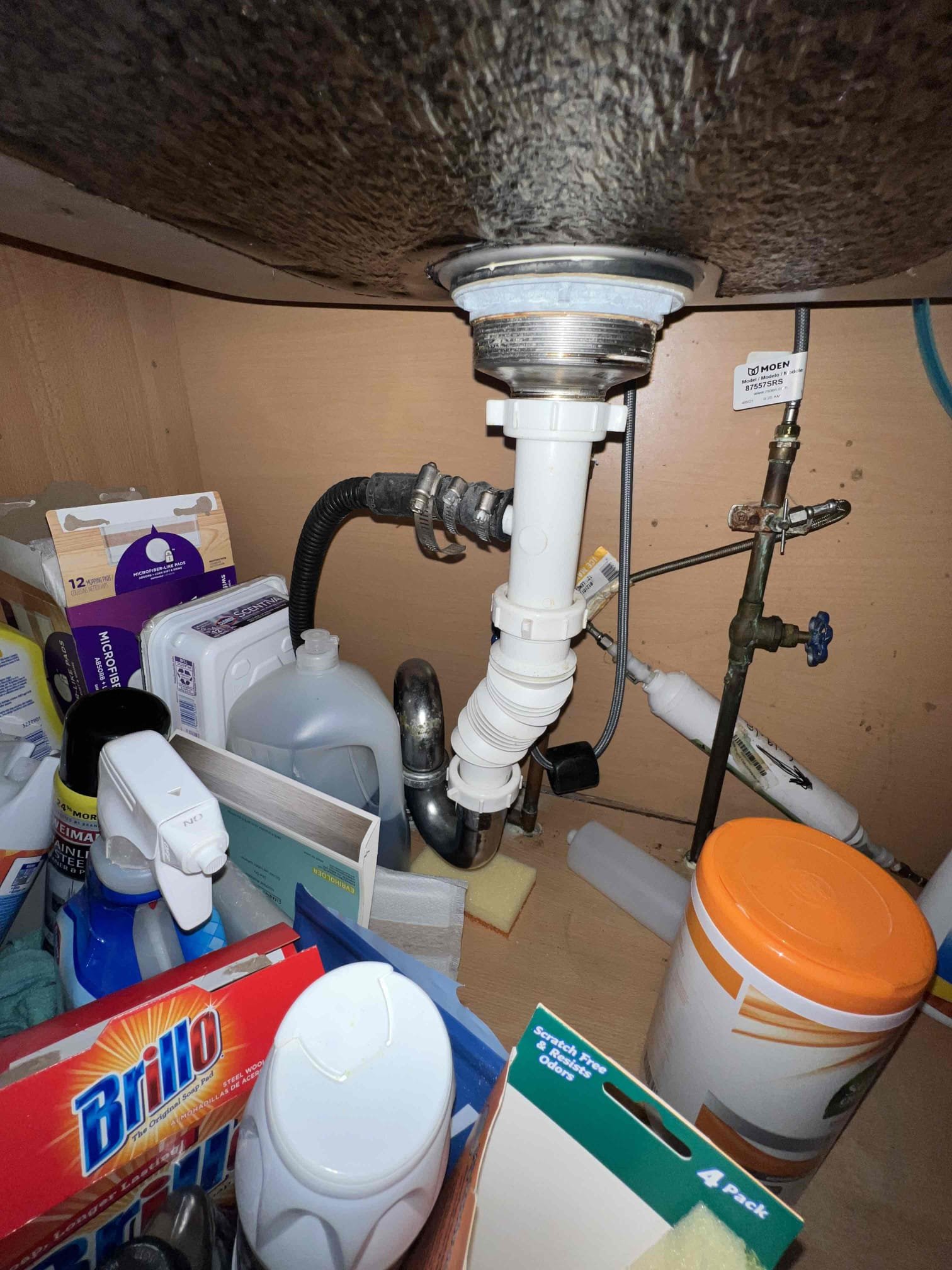 Arrived on site to perform plumbing inspection. Today we found that underneath the kitchen sink there are old gate valves for emergency shutoff valves underneath the sink and there is a saddle valve for the ice maker. There is also an S trap with an accordion style tailpiece as well. Left options for a complete rebuild and to add a studor vent underneath the sink.