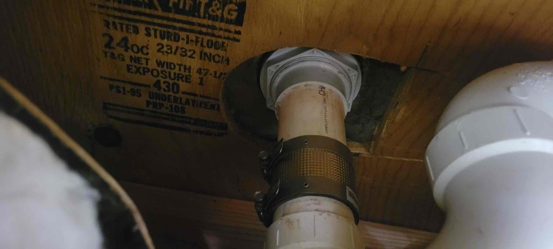 Cut Sheetrock to access the drain.
Cut out and removed existing shower strainer from the stall.
Cleaned flange of enclosure.
Supplied and installed new 2 in shower strainer.
Applied sealant and secured my connections.
Adapted to existing trap using a no hub coupling.
Secured those connections and turned the shower on both hot and cold water to check for leaks.
There are no leaks at this time.