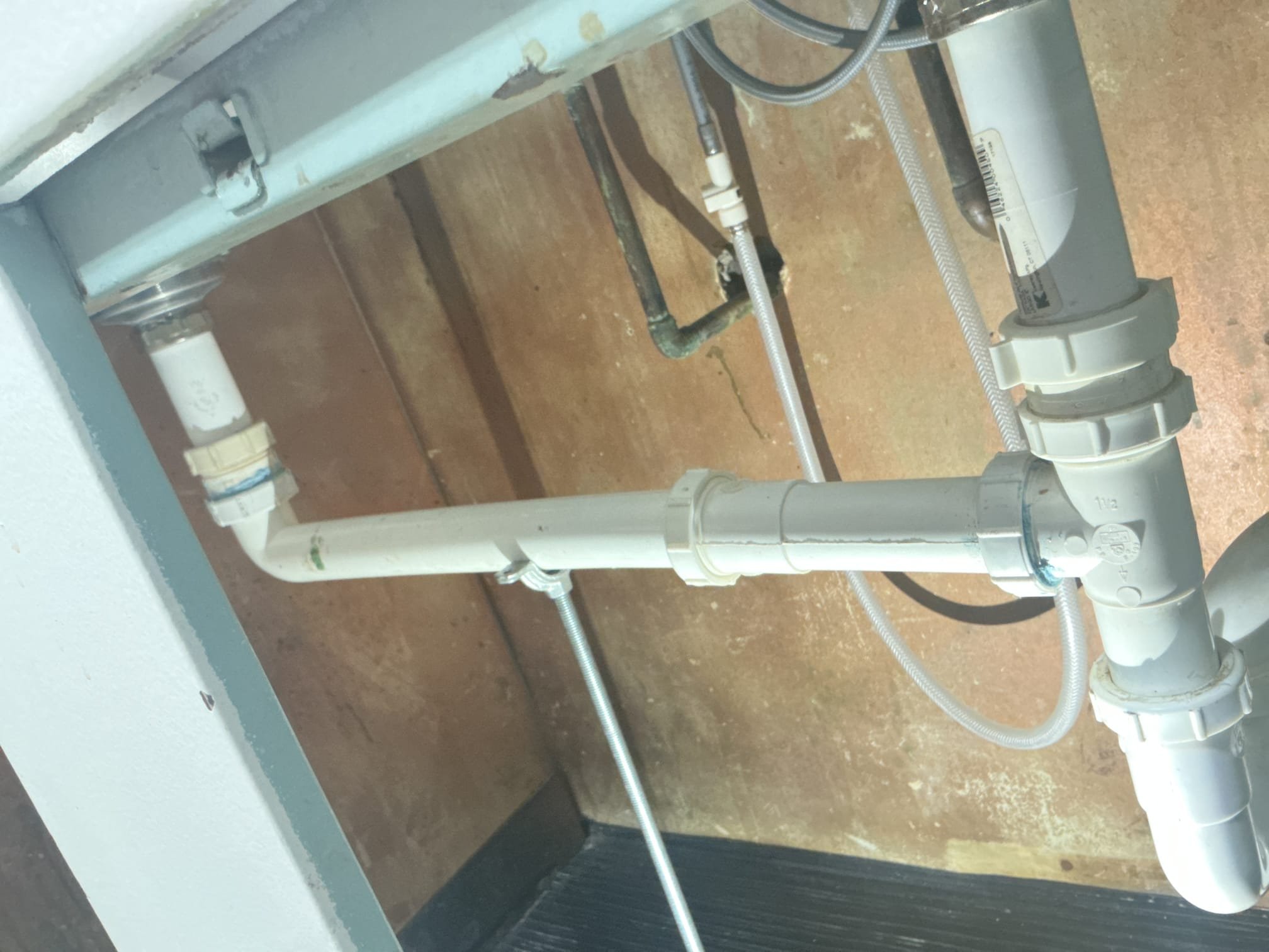 Arrived to the home, client has a double bowl sink that the tubular got clogged and the arm fell due to the weight of the clog, there is low and S trap due to the drain bing floor roughed. I advised to the client to have me hard pipe the drain and add a studor vent. After providing multiple options to the client, they would like us just to reinstall the tubular arm and support it some way. I advise to the client that I will due that but i can not provide any warranty for today due to the drain not being legal, and the reinstallation of the existing parts. I supported the pipe and pressure tested the sink to check for leaks. There are no leaks at this time. Client is aware that MyGuy plumbing can not provide any warranty for today.