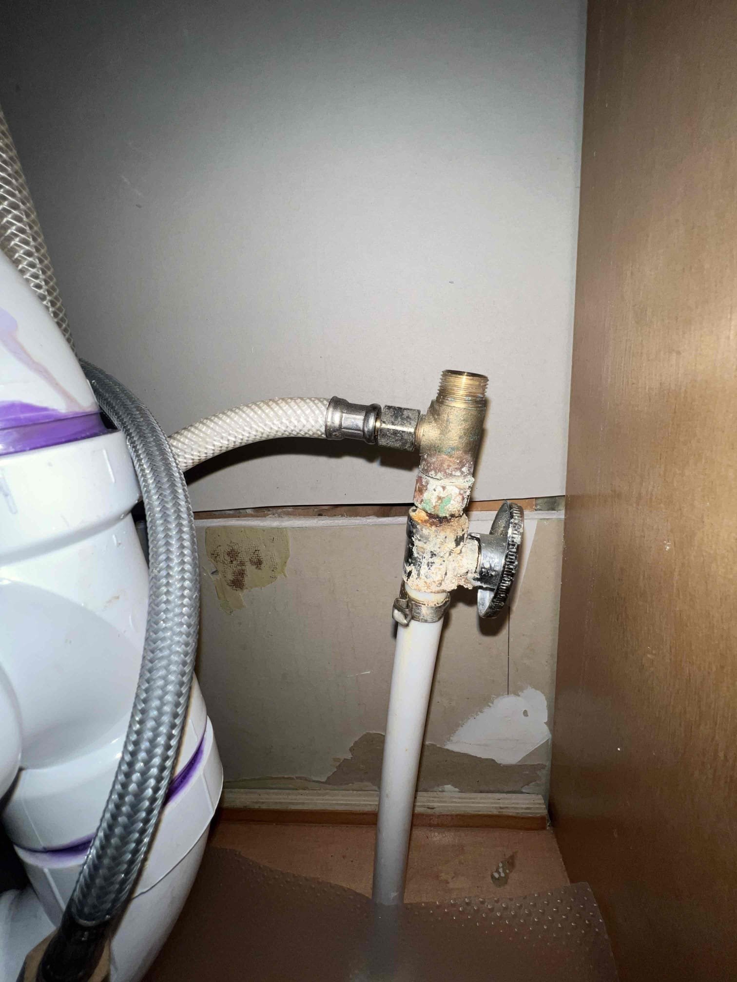 Arrived on site to a possible recall. Upon inspection the nut below the dishwasher tailpiece appeared to be cross threaded so I replaced the nut and it is no longer leaking. Client brought to my attention that she thinks the ice maker to her fridge is leaking so she would like for us to remove the valve for the icemaker. Since the icemaker and cold side for the faucet share the same valve I have to replace that valve and remove the tee fitting. Since all valves appear to be old and corroded client felt it was a good idea to replace all of them under the kitchen sink. The nut on the hot side supply line for the faucet broke as I tried removing it and since it is an integral part we had to replace the faucet as well. When done I tested all connections for leaks with hot water and there are no longer any leaks.