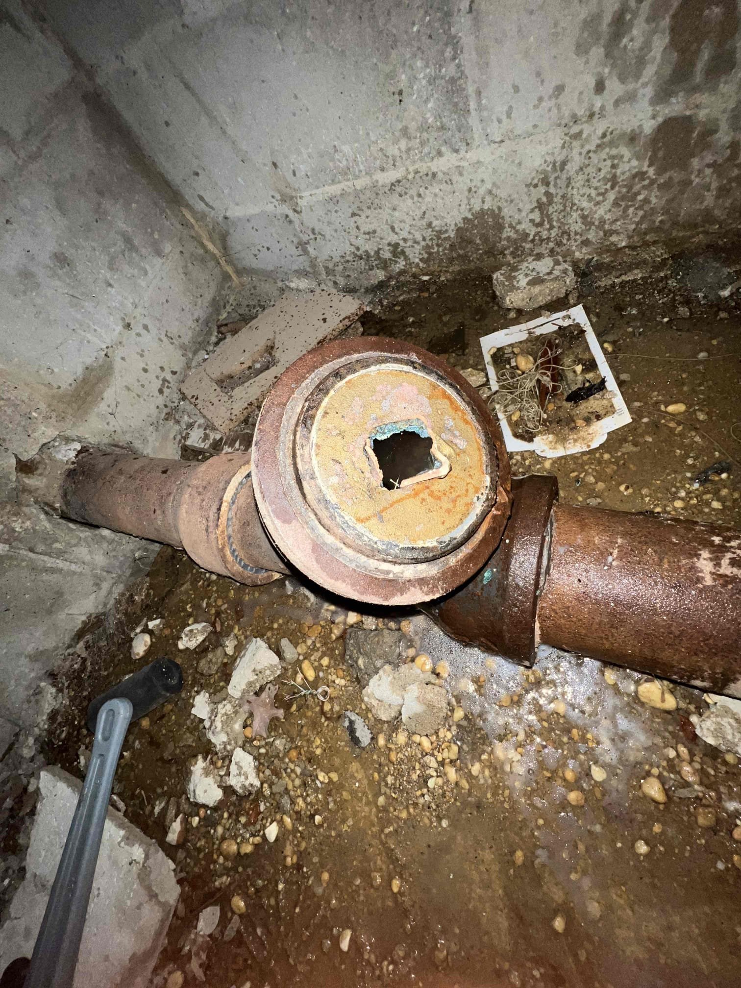 Arrived on site client stated that tooth their toilets and kitchen was backing up. Their are clean-outs in the basement but I wanted to avoid flooding the basement so we pulled the toilet to snake the main line. After attempts to  snake the main I found flushable wipes on the cable and it was getting stuck and binding up so we went in the basement out a bucket by the cleanout and removed the 4” brass cleanout cap. Snaked the main multiple times but was getting stuck so we stuck a blow bag down the main using hot water from the water heater for 5 minutes and the main was cleared. After clearing the main we put a camera down the line and found a bunch of sludge and toilet paper. Clog appeared to be due to a soft blockage. We must return again to put a proper cap on the 4” main so for now I put a 4” dollar plug as a cap.