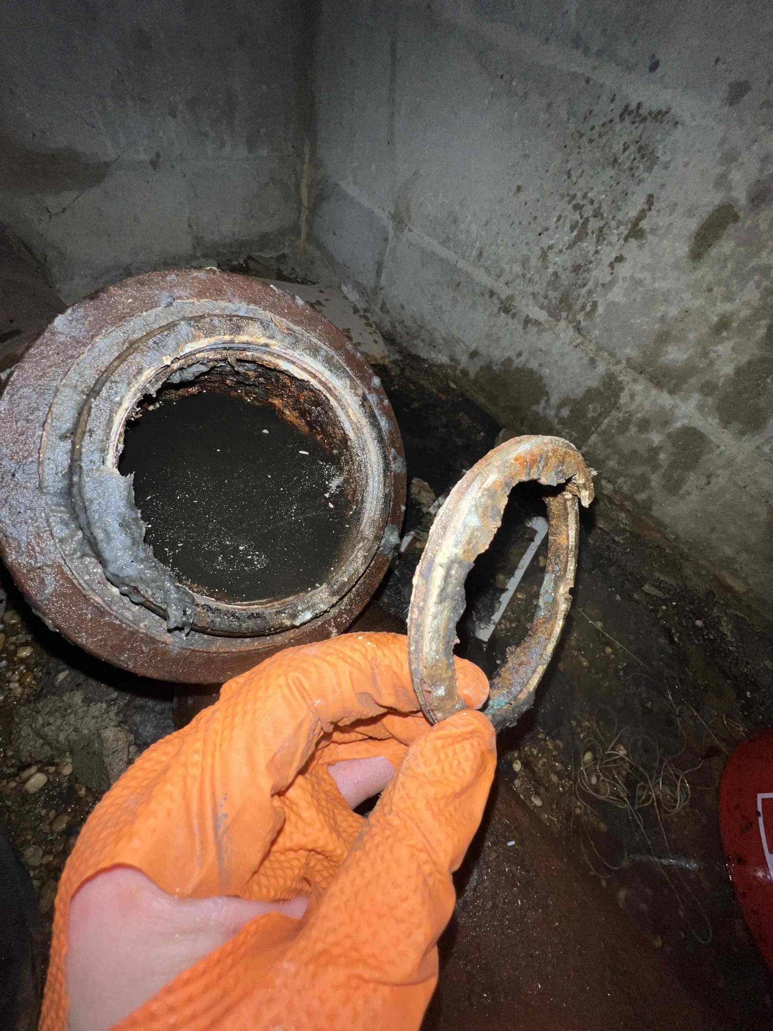 Arrived on site client stated that tooth their toilets and kitchen was backing up. Their are clean-outs in the basement but I wanted to avoid flooding the basement so we pulled the toilet to snake the main line. After attempts to  snake the main I found flushable wipes on the cable and it was getting stuck and binding up so we went in the basement out a bucket by the cleanout and removed the 4” brass cleanout cap. Snaked the main multiple times but was getting stuck so we stuck a blow bag down the main using hot water from the water heater for 5 minutes and the main was cleared. After clearing the main we put a camera down the line and found a bunch of sludge and toilet paper. Clog appeared to be due to a soft blockage. We must return again to put a proper cap on the 4” main so for now I put a 4” dollar plug as a cap.