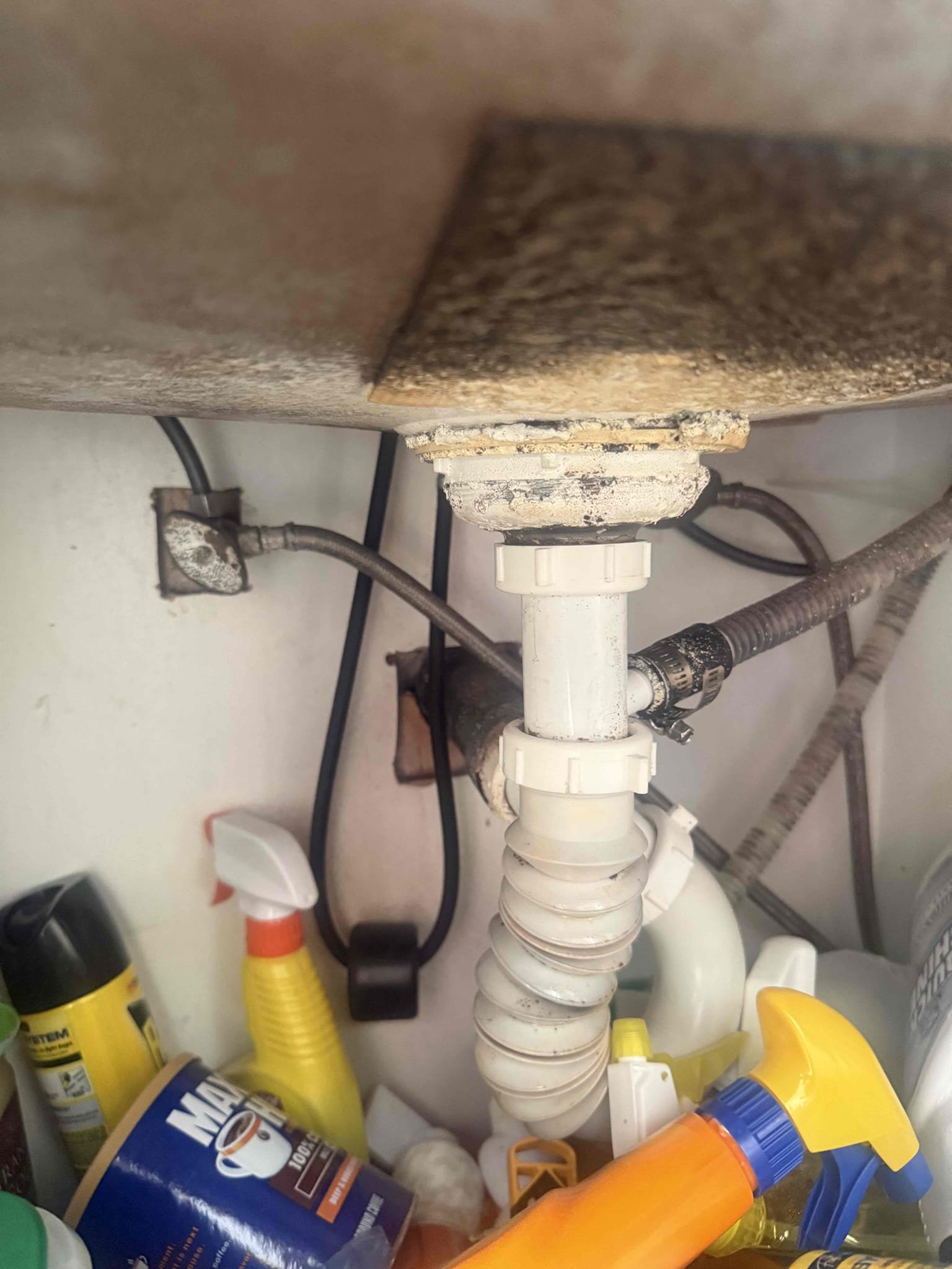 Arrived to home for frozen pipe. Upon inspection found that there was very low pressure to kitchen faucet but hot line was warm. Removed aerator and found that it was clogged. There is full pressure now. Kitchen drains have accordion trap and basket strainer looks very corroded. There is not separate valves for dishwasher and ice maker. Recommend complete rebuild under kitchen. Gate valve as main shut off. Collected 59 and will credit