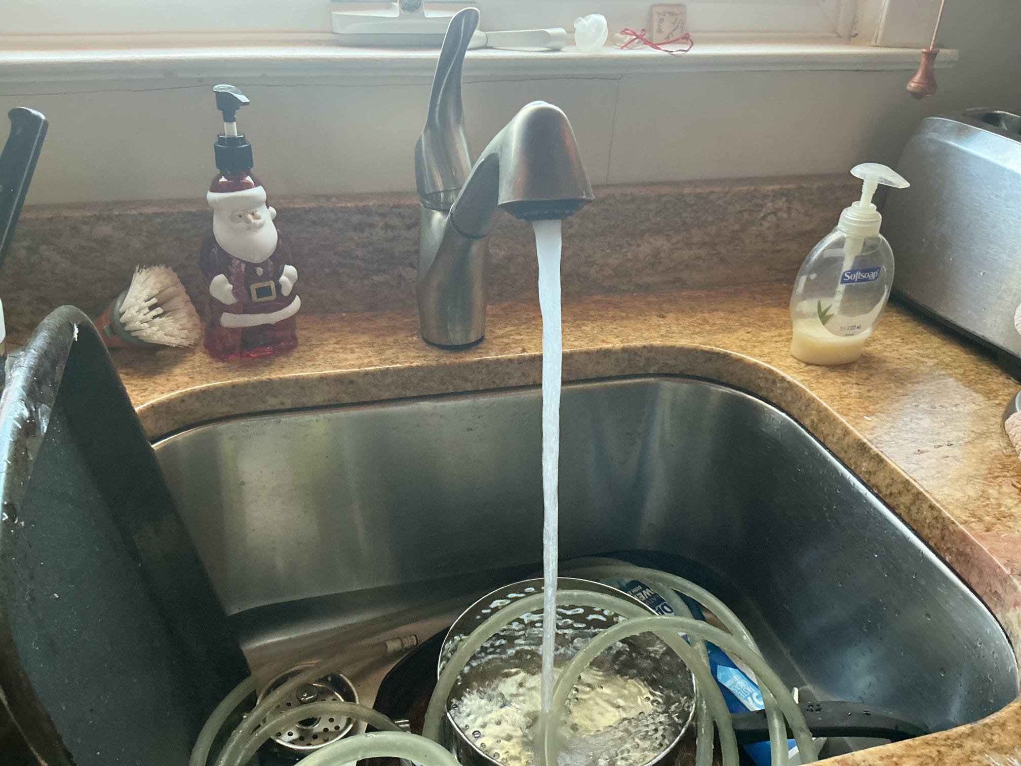 We had recently repaired freeze breaks in the home, we arrived today due to low water pressure at the kitchen faucet, bathroom faucet, and shower head. I first disconnected the sprayer and discovered that the aerator was completely clogged. I cleaned the aerators for all the fixtures and flow and water pressure has been restored. 59$ waived.