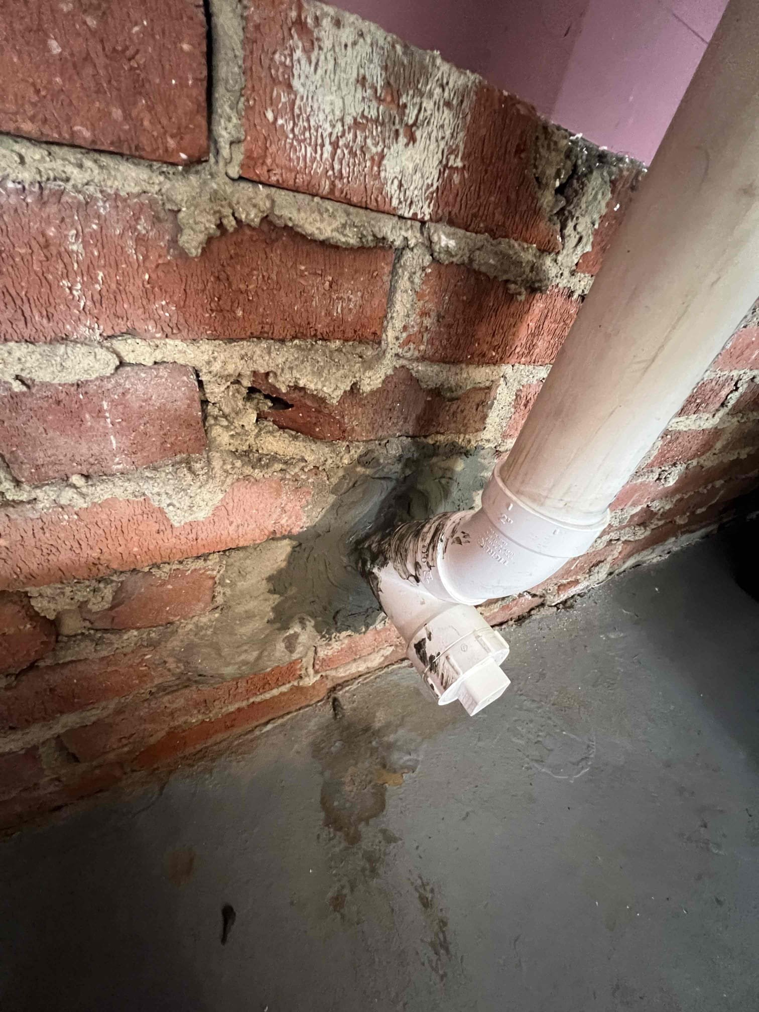 Cut out galvanized and chip brick

Arrived on site to cut a part of kitchen line and repipe. When we cut the old galvanized we found ice in the old fittings causing the blockage. Being that the old galvanized sanitary tee was old and rusted we had to cut it out anyway and chip away at some brick to put a new pipe through the wall. Added new cleanouts for inside the garage and outside. When done repiping we tested for leaks with hot water and sealed any gap in the wall with hydraulic cement. Faucet started to leak so we replaced faucet as well covered old side sprayer with cock hole cover.