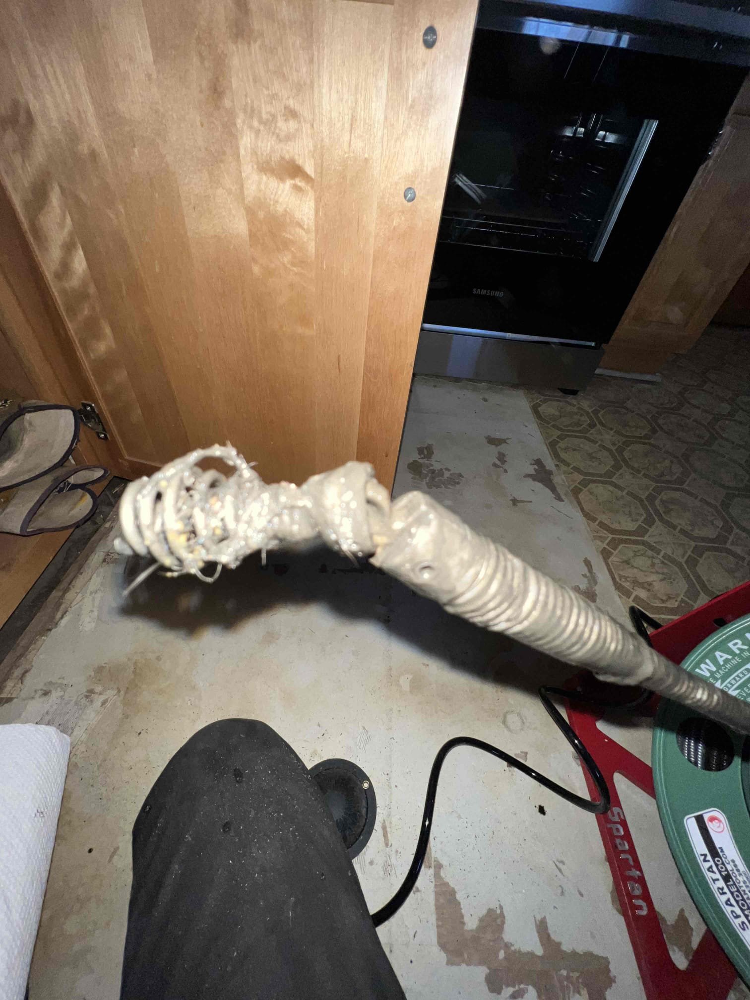 Arrived on site client stated they had a leak under the kitchen sink and that it was backed up. Upon inspection the basket strainer on the left appears to be the cause of the leak. Unsure of what the clog was could’ve been frozen but the snaking seemed to do the trick. When done I ran tons of hot water and filled both sinks up multiple times. There are no leaks at this time and sink is now draining as it should.