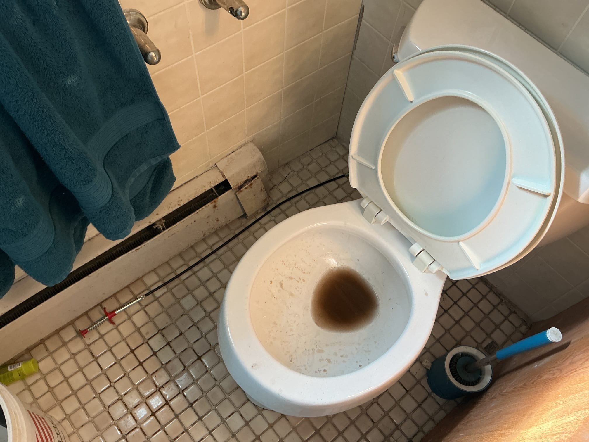 Arrived to the home, client states they had flushed their toilet paper roll holder down the toilet. I provided options to the client and advised them to have me first try to auger it. I was unsuccessful in doing so, i then pulled the toilet. After placing the toilet on its side, I could see the holder stuck in the trap way. I next snaked from the base through the opening of the toilet. In doing so, I was able to remove the holder. I then supplied and installed new wax seal, Johnny bolts, and supply line. I secured the toilet to the flange and flushed the toilet to check for leaks, there are no leaks at this time.

*The flooring in the bathroom is in very poor shape, the toilet still has a slight rock to it but is not leaking at this time, client is aware.