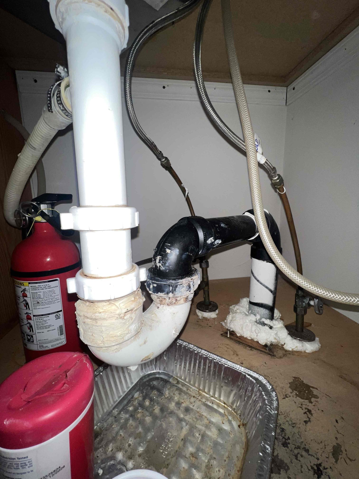 Arrived on site client stated they had a leak under the kitchen sink. Upon inspection the leak appears to be coming from multiple joints under the kitchen sink. Basket strainer also appears to be old as well. When checking out the water heater there were old water stains and it is 23 years old. Left prices to replace water heater and fix the drainage under the kitchen sink.