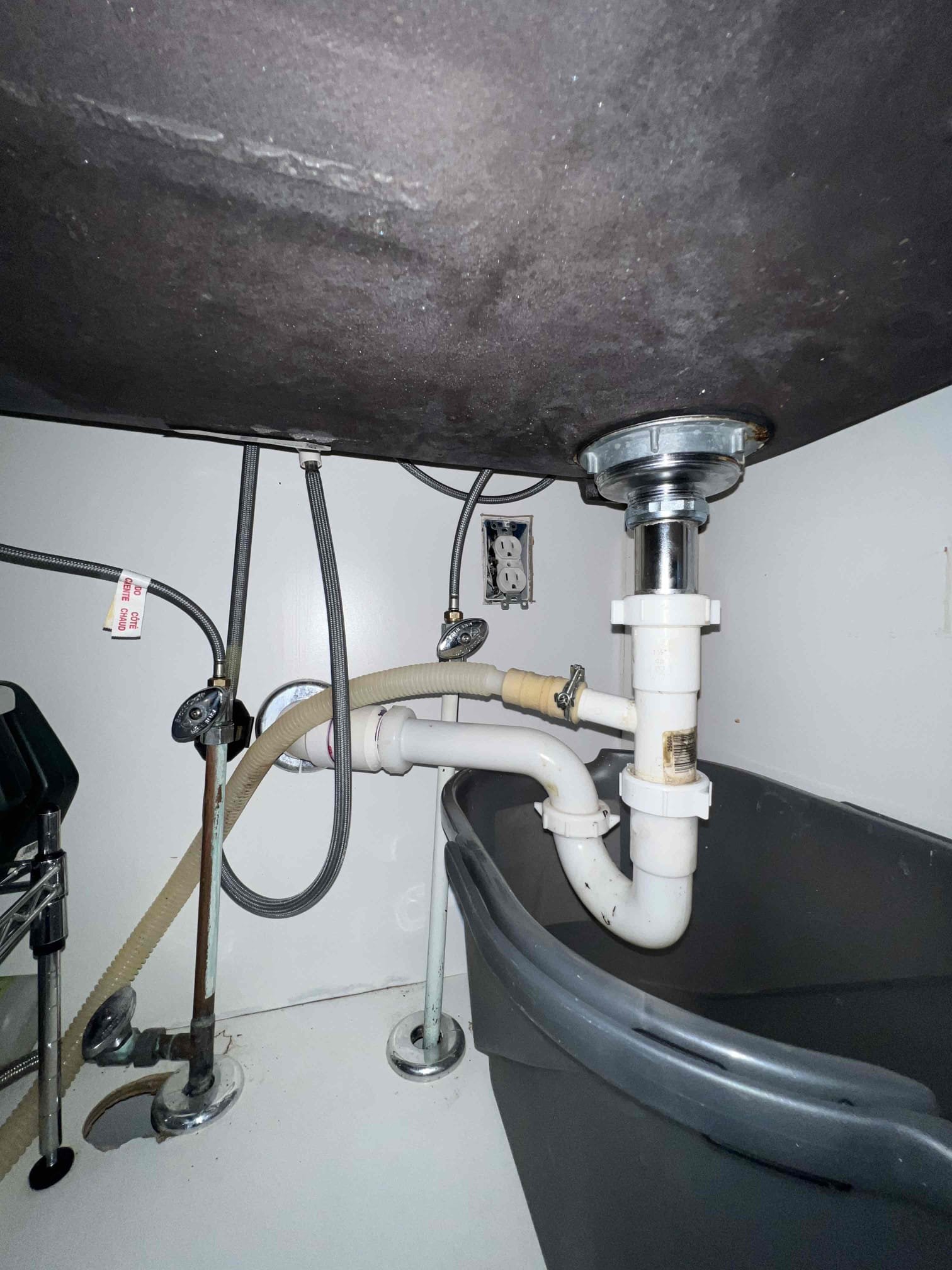 Arrived on site client stated that he had a leak under the kitchen sink. Upon inepction I noticed a little bit of moisture underneath the basket strainer. Client stated he thinks thier maybe another leak on the nut for the trap arm but during testing I did not see any others other than the basket strainer at this time. I also noticed the valves were corroded but client wanted to just replace the basket strainer at this time. When done I tested with hot water and filled the sink up. There are no leaks at this time.