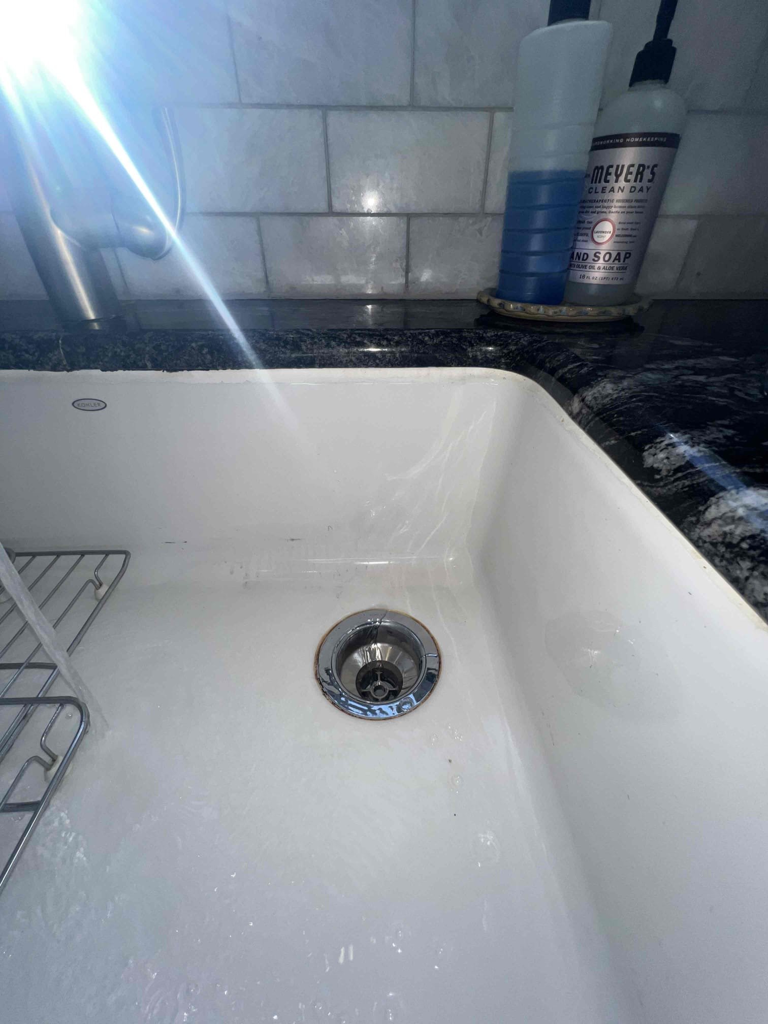 Arrived on site client stated that he had a leak under the kitchen sink. Upon inepction I noticed a little bit of moisture underneath the basket strainer. Client stated he thinks thier maybe another leak on the nut for the trap arm but during testing I did not see any others other than the basket strainer at this time. I also noticed the valves were corroded but client wanted to just replace the basket strainer at this time. When done I tested with hot water and filled the sink up. There are no leaks at this time.