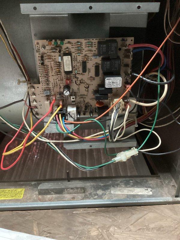 Replaced faulty control board on 25-year-old LP furnace that was failing to maintain operation. Unit would initially light but would not stay running due to overheating relay. Installation of new control board successfully restored proper furnace operation after previous homeowner maintenance likely damaged original board.