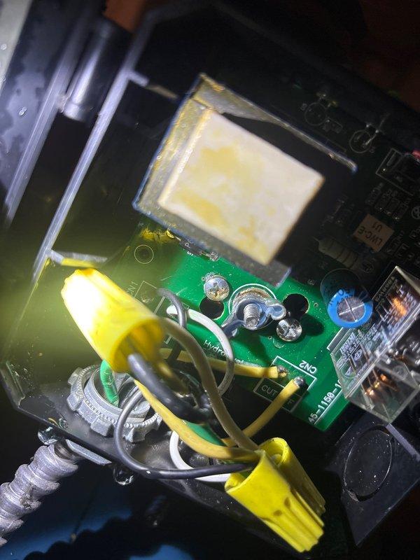 Diagnosed and replaced leaking probe on low water cutoff of natural gas heating system. Inspected control board and connection points for proper functionality after repair. System now operating normally with no evidence of leakage.