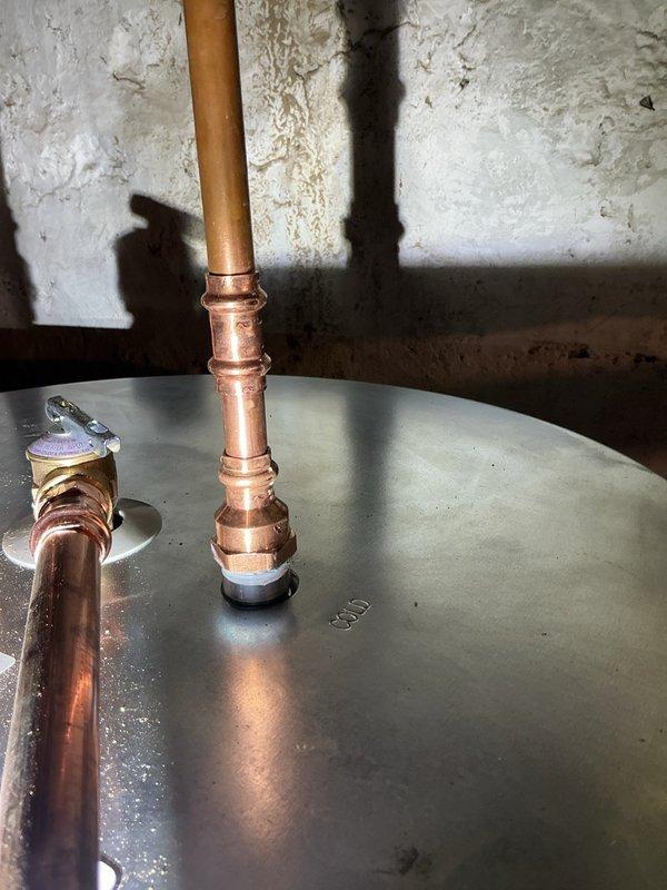 Completed installation of a new 50-gallon electric water heater with Silver plan coverage. Installed approximately 10' of PEX piping to restore water distribution system and mounted a pressure reducing valve to maintain safe operating water pressure in the home. All connections were properly secured and system was tested for proper operation before completion.