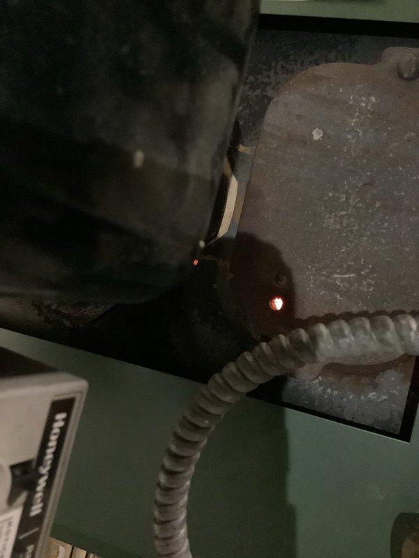 Responded to a no-heat call for a new customer with an aging oil boiler (14+ years). Diagnosed issue with system startup failure after customer's nightly shutdown practice. Inspected connections and operational components in the basement utility area, noting the boiler was shutting down due to overheating caused by improper cycling. Restored heat by adjusting control settings and advised customer against turning system off completely at night, recommending thermostat setback instead for proper operation and system longevity.