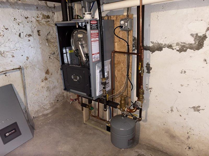 Completed annual tune-up on Burnham Alta combi boiler (installed April 2025). Inspected control panel interface and accessed diagnostic codes to verify proper operation. Re-routed condensate line using 3/8" PEX coupling as required.