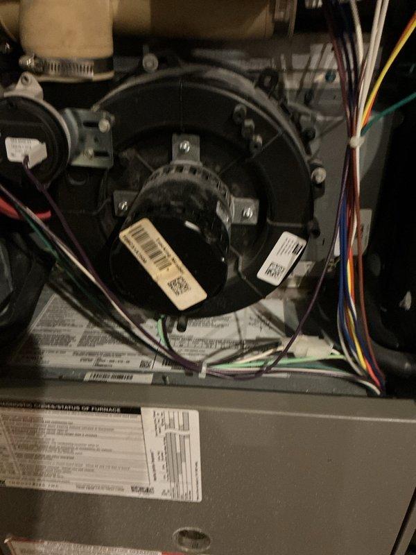 Responded to service call for 17-year-old natural gas furnace with reported high-pitched noise during operation. Upon inspection, found worn blower motor bearings causing noise; verified burner assembly functioning properly with normal flame pattern and no signs of heat exchanger issues. Replaced blower motor assembly, lubricated all necessary components, and performed operational test to confirm normal system function with noise eliminated.