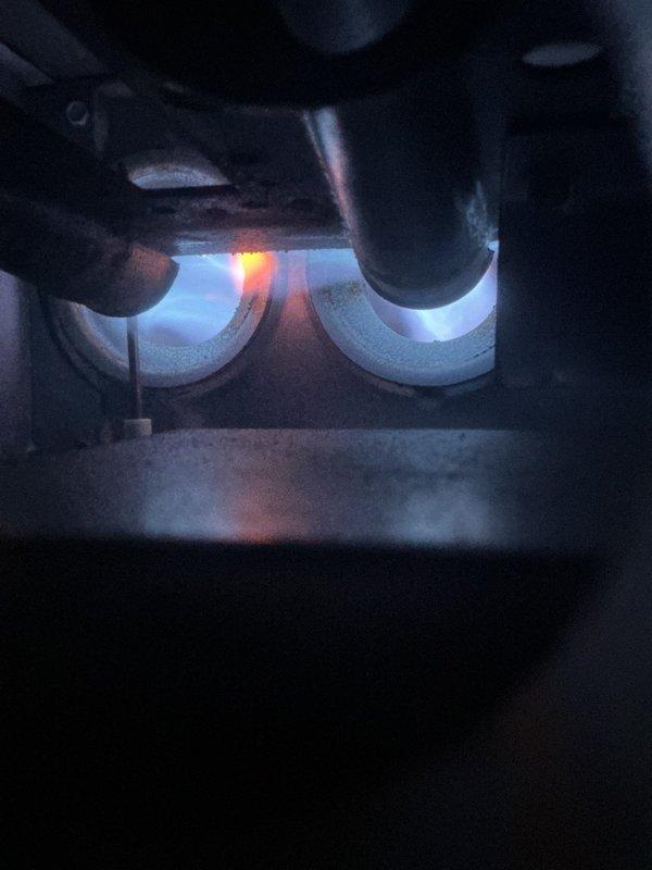 Responded to service call for 17-year-old natural gas furnace with reported high-pitched noise during operation. Upon inspection, found worn blower motor bearings causing noise; verified burner assembly functioning properly with normal flame pattern and no signs of heat exchanger issues. Replaced blower motor assembly, lubricated all necessary components, and performed operational test to confirm normal system function with noise eliminated.