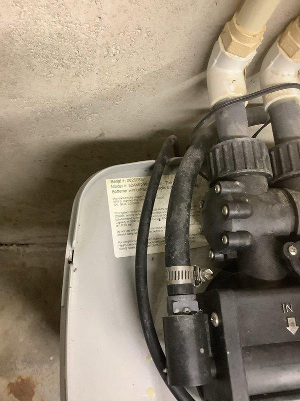 Responded to service call for leaking Hague Water Max 52 AMQ system that had been placed in bypass mode. Inspected the complete water treatment setup including the Water Max unit and Hague reverse osmosis system with Hydronix pre-filter, carbon post-filter, and RO membrane assembly. Evaluated system components, checked filter conditions, and assessed the leak source on the primary softener unit to determine necessary repairs using parts previously received and staged in warehouse.