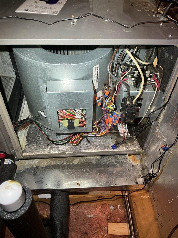 # Indoor Air Quality System Installation

Successfully installed two indoor air quality enhancement devices on existing HVAC system: REME HALO air purification unit and Micro Guard filtration system. Both units were mounted within the main supply plenum and integrated with the existing ductwork to provide whole-home air treatment. Electrical connections were made to the air handler's control board, with proper wire routing and securing to prevent interference with blower operation. 

Installed whole-system surge protection device at the electrical service panel to safeguard HVAC equipment from voltage spikes and power surges. Device was wired in accordance with manufacturer specifications and local electrical code requirements. Digital display confirmed proper voltage reading of 125.8V, indicating normal operation and active protection status.

All installations were completed in the mechanical room area. Access panels were secured following installation, and system was tested for prop