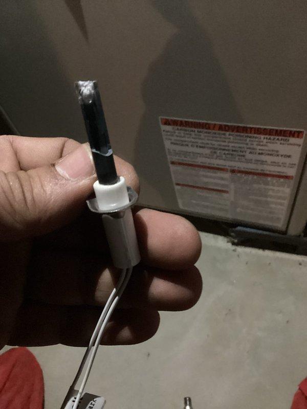 Responded to no-heat call where thermostat activated air conditioning and fan operation normally, but heating system failed to ignite. Upon inspection, diagnosed faulty hot surface igniter as root cause of heating failure. Removed defective igniter from furnace burner assembly and replaced with new component. Verified proper electrical connections and tested system operation to confirm successful ignition sequence and heat production. System restored to full heating functionality.