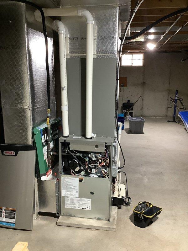 Completed comprehensive tune-up and maintenance on Lennox propane gas furnace system installed in June 2021. Performed standard inspection of burner assembly, heat exchanger, blower components, and venting system; verified proper operation and combustion efficiency. Addressed ongoing heat pump outdoor sensor issue causing frequent low battery alerts on thermostat, with battery replacement lasting only 10 days between changes; inspected sensor wiring, connections, and thermostat communication for potential power drain or faulty component requiring further diagnosis.