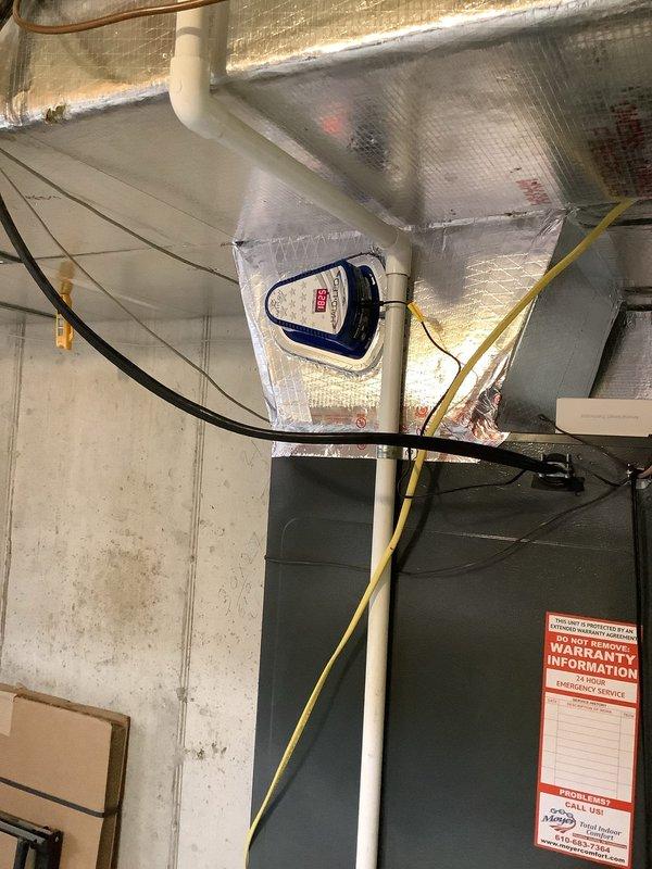Completed re-check of recently installed Moyer Series heat pump and Daikin ductless heat pump system. Performed AC operational check on both units, re-wired electrical disconnect, verified humidifier wiring connections, and installed REME Halo LED air purification system. Delivered utility rebate packet for completion and documented installation with photos showing exterior equipment mounting and interior air handler configuration.